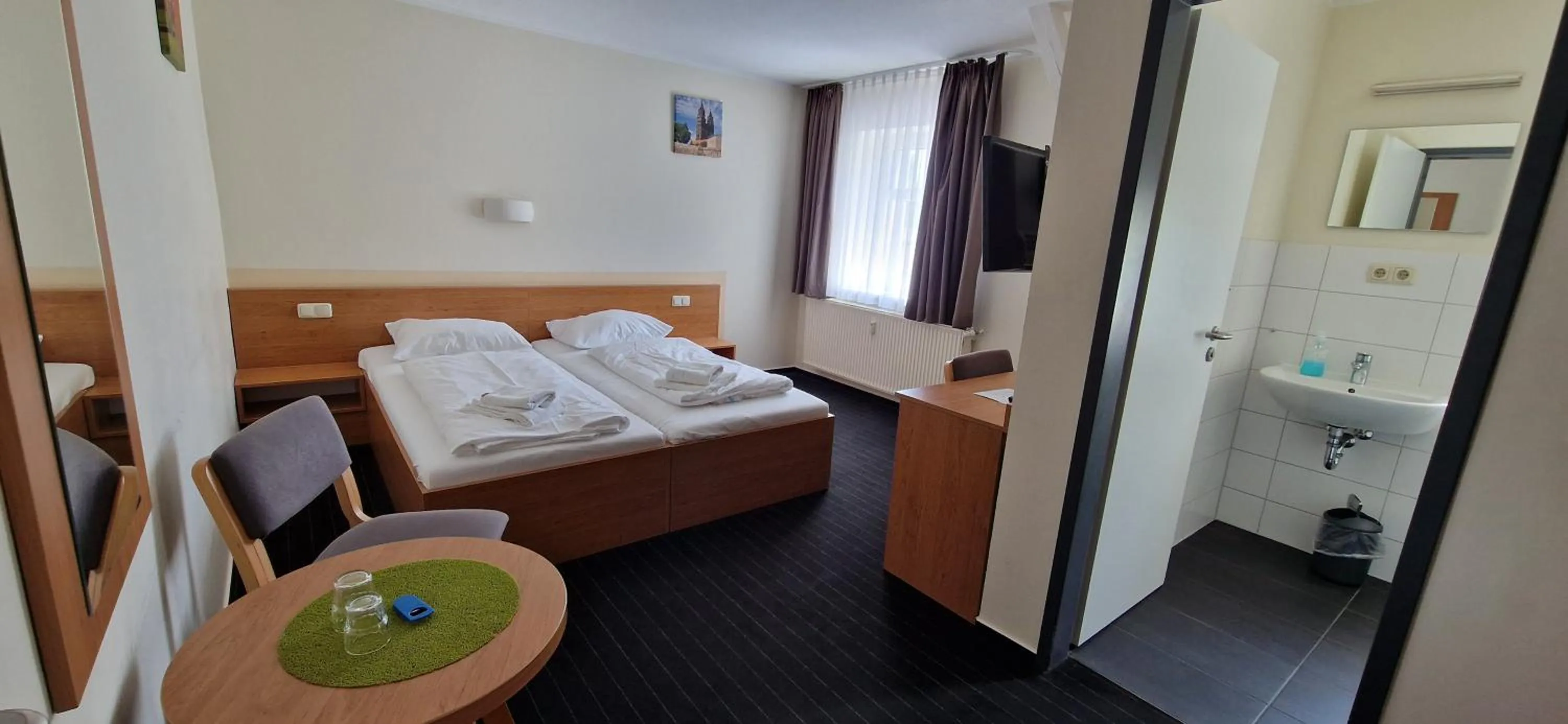 Photo of the whole room, Bed in City-Pension Magdeburg
