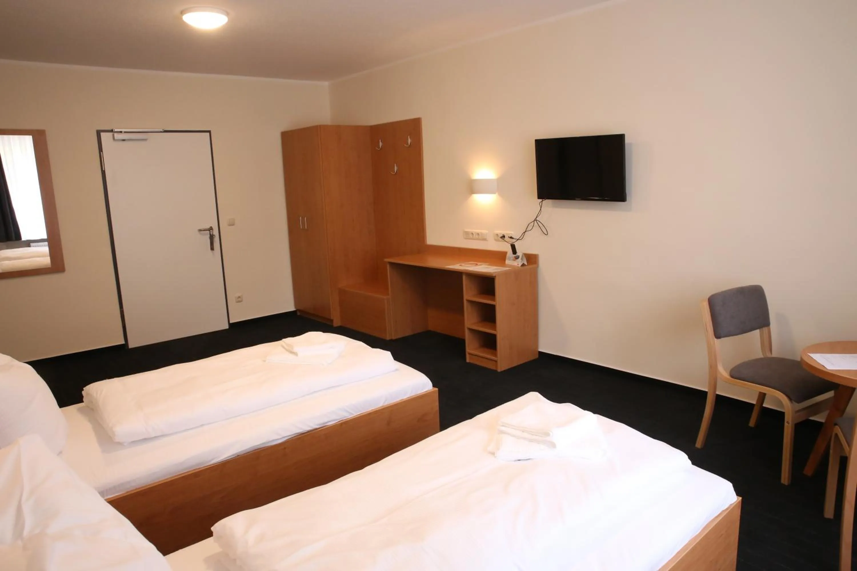 Photo of the whole room, Bed in City-Pension Magdeburg