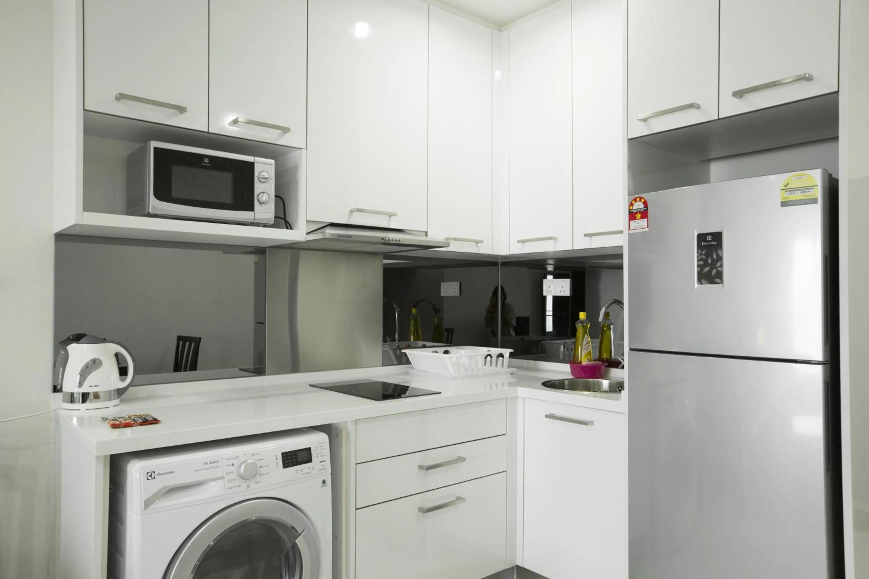 Kitchen or kitchenette in Mercu Summer Suites Bernice KLCC