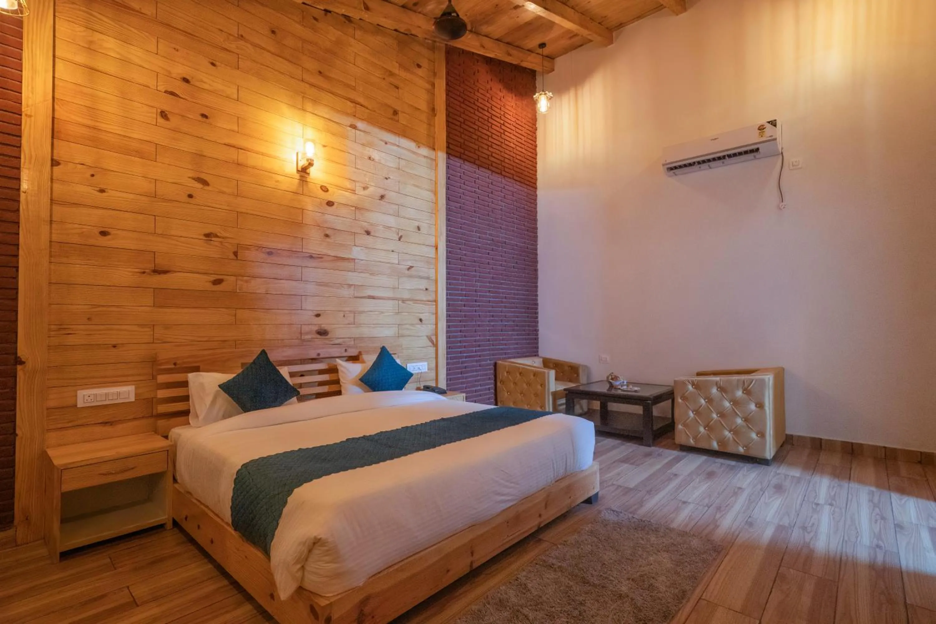 Seating area, Bed in The Forest Resort By 3Tree Group