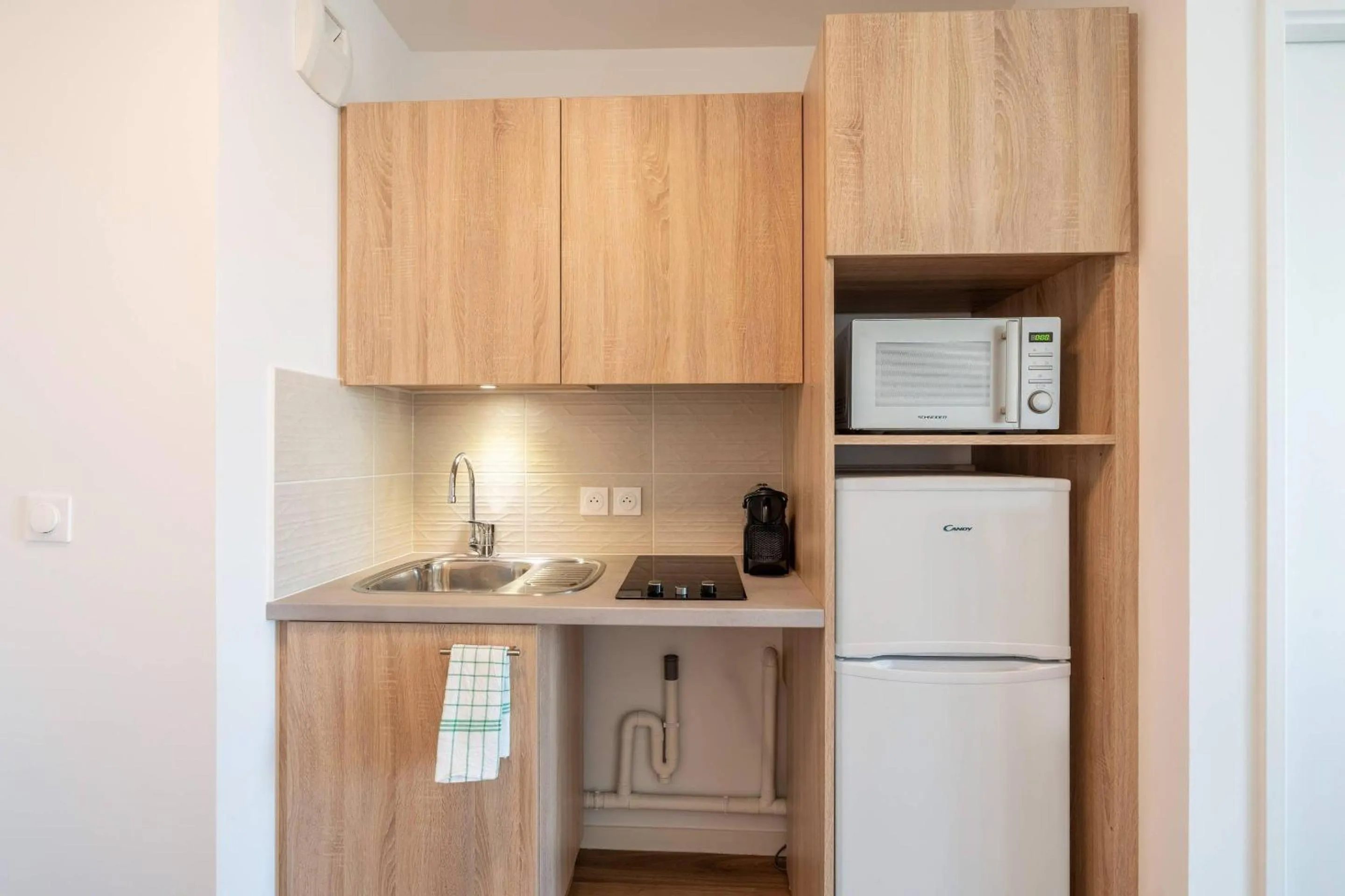 Kitchen or kitchenette in Quality Aparthotel Choisy Orly Airport