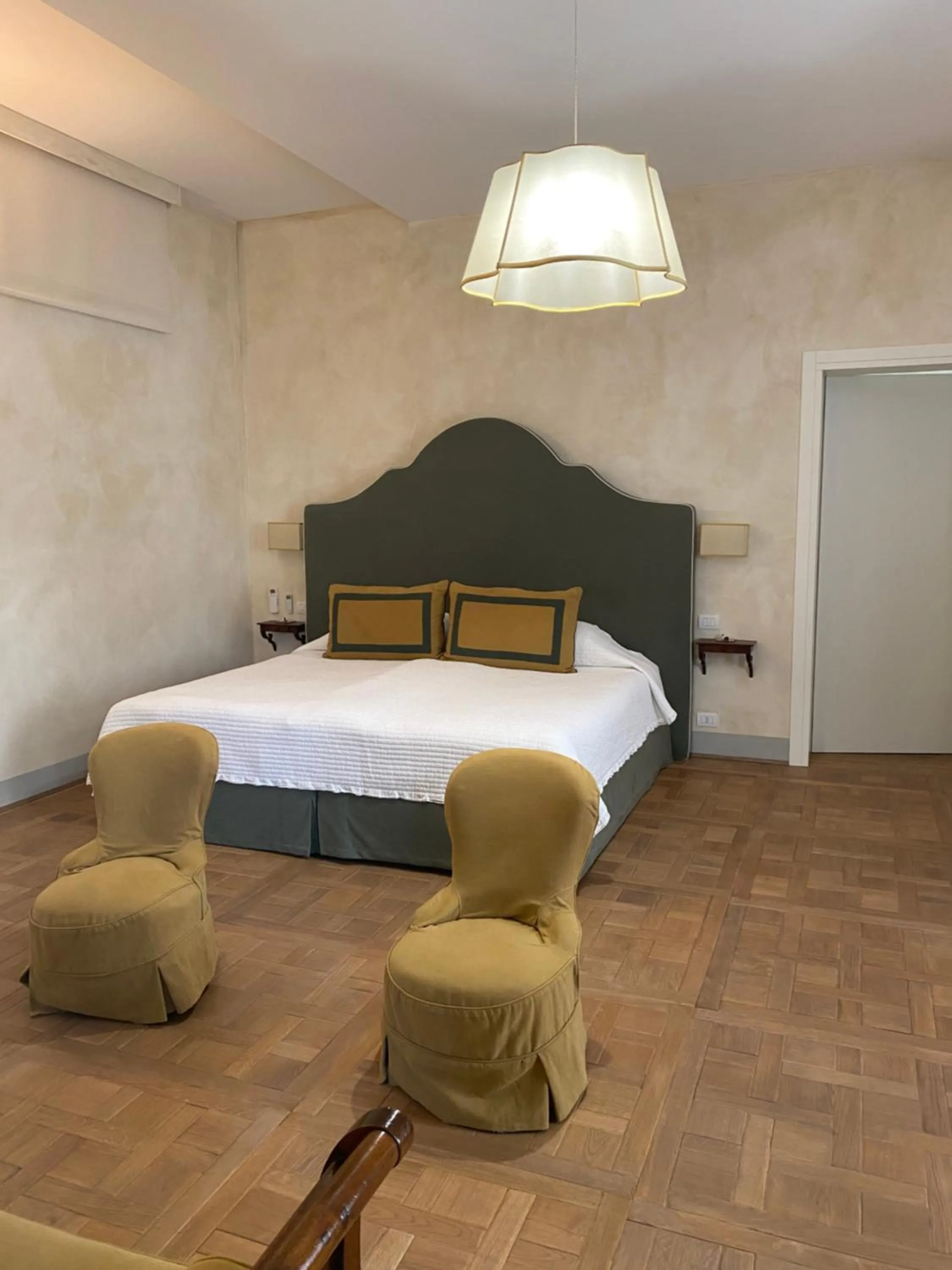 Bed in Palazzo Mantua Benavides Suites & Apartments