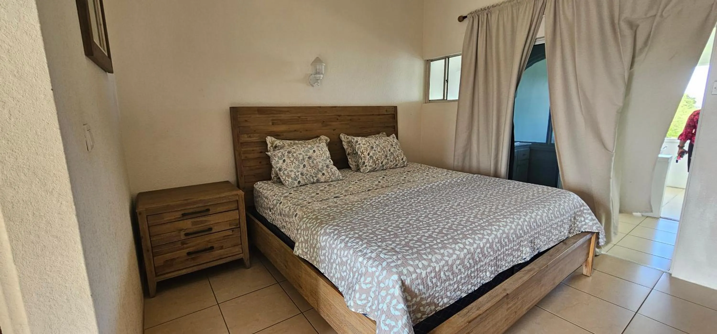 Bed in Wavecrest Suites