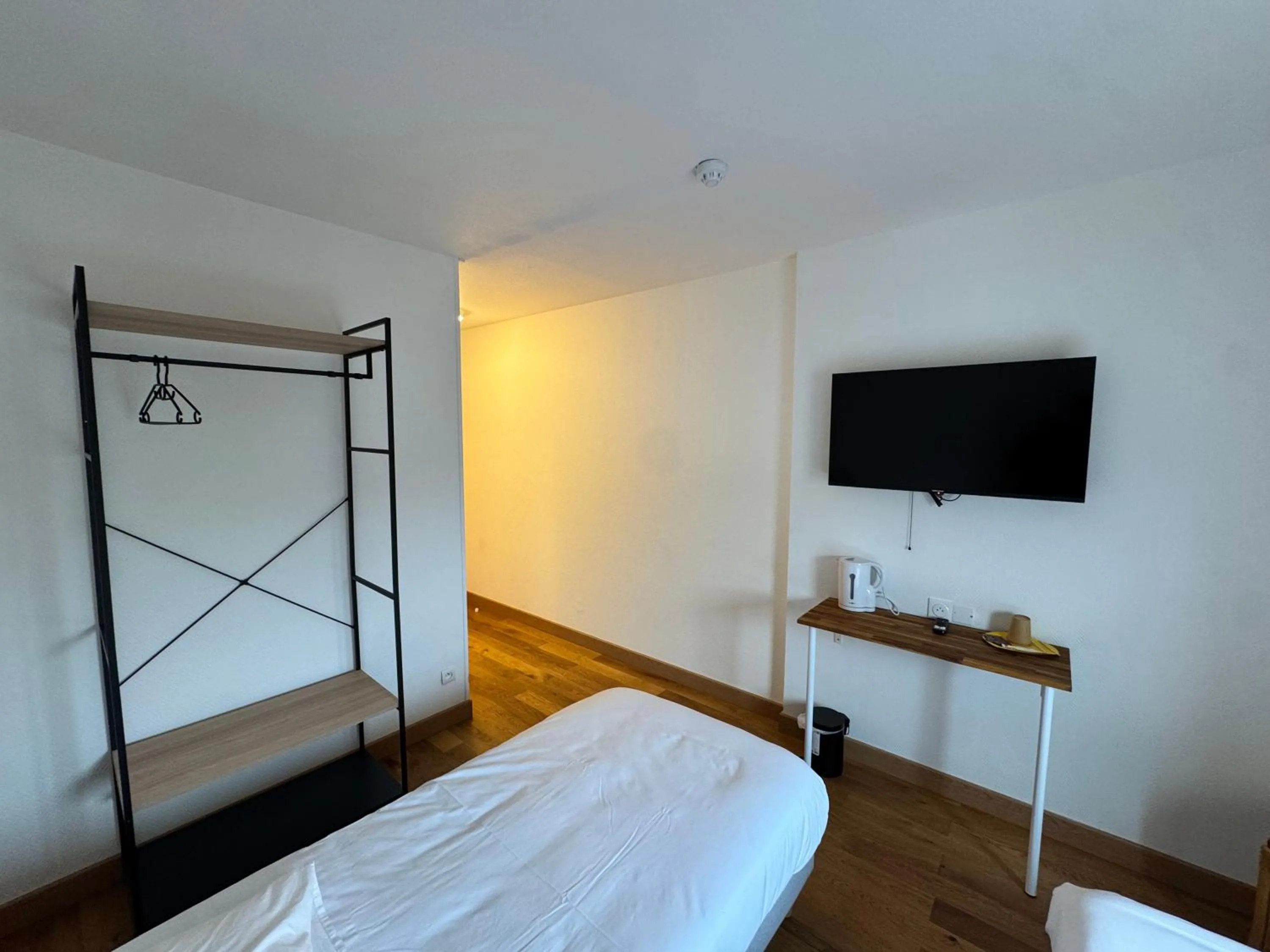 Bed in Hôtel Arc-en-Ciel