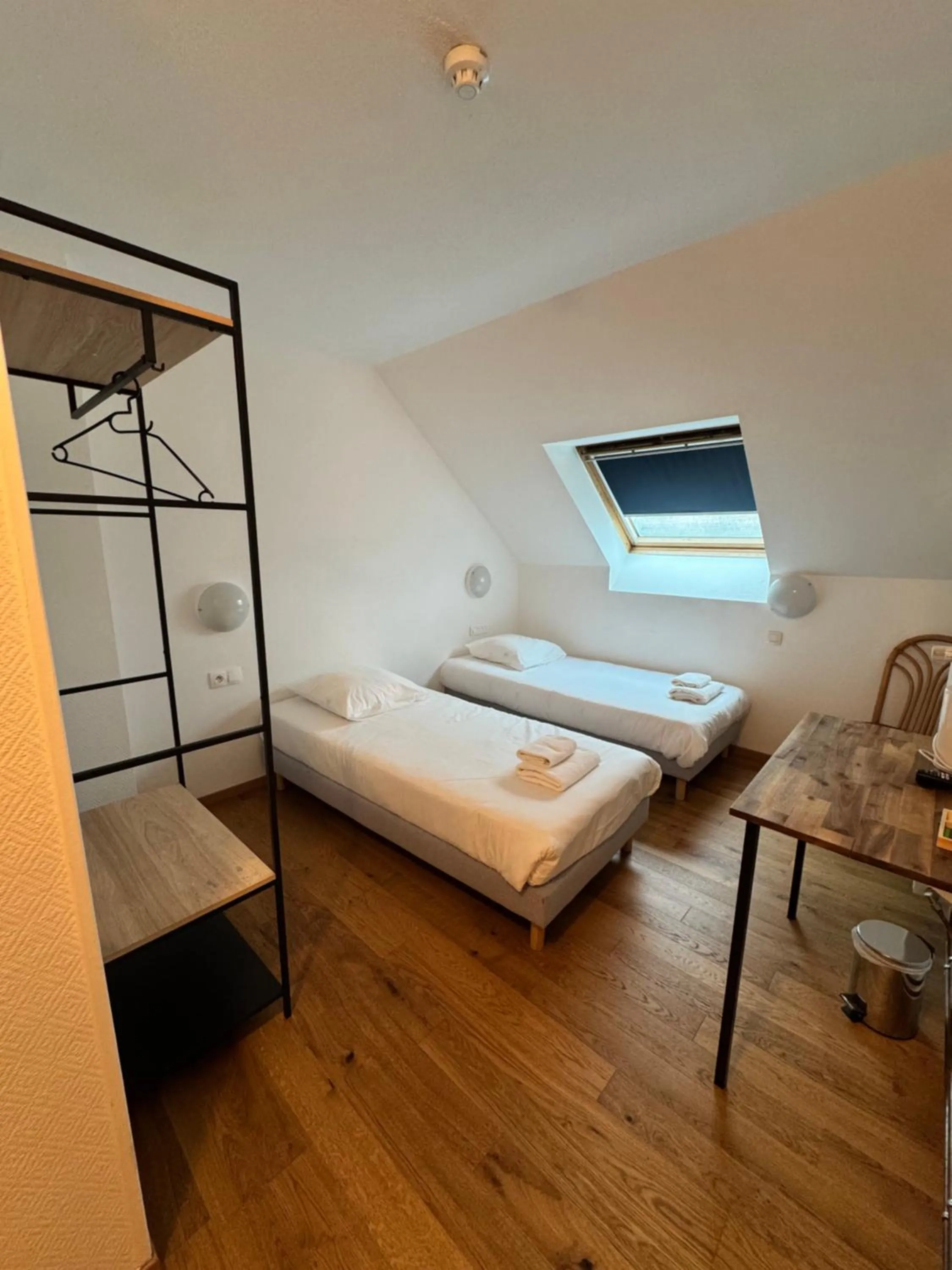 Bed in Hôtel Arc-en-Ciel