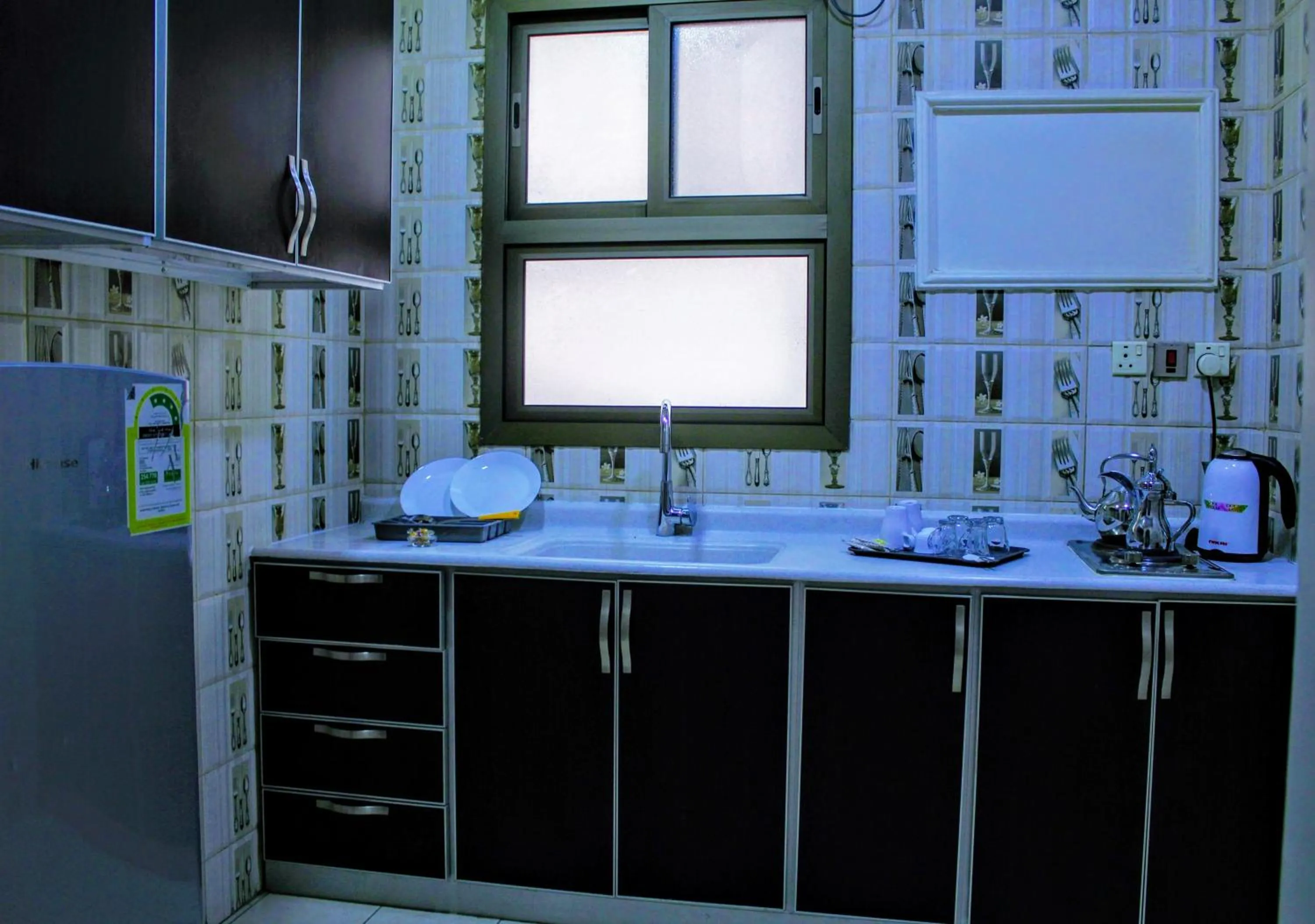 Kitchen or kitchenette in Aros Al Faisaliah Furnished Units