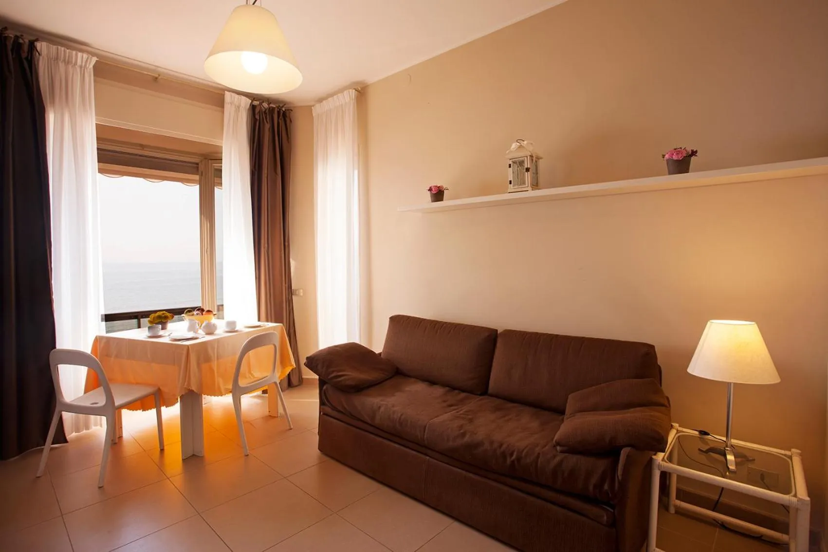 Seating area in Residence Sole Mare Alaxi Hotels