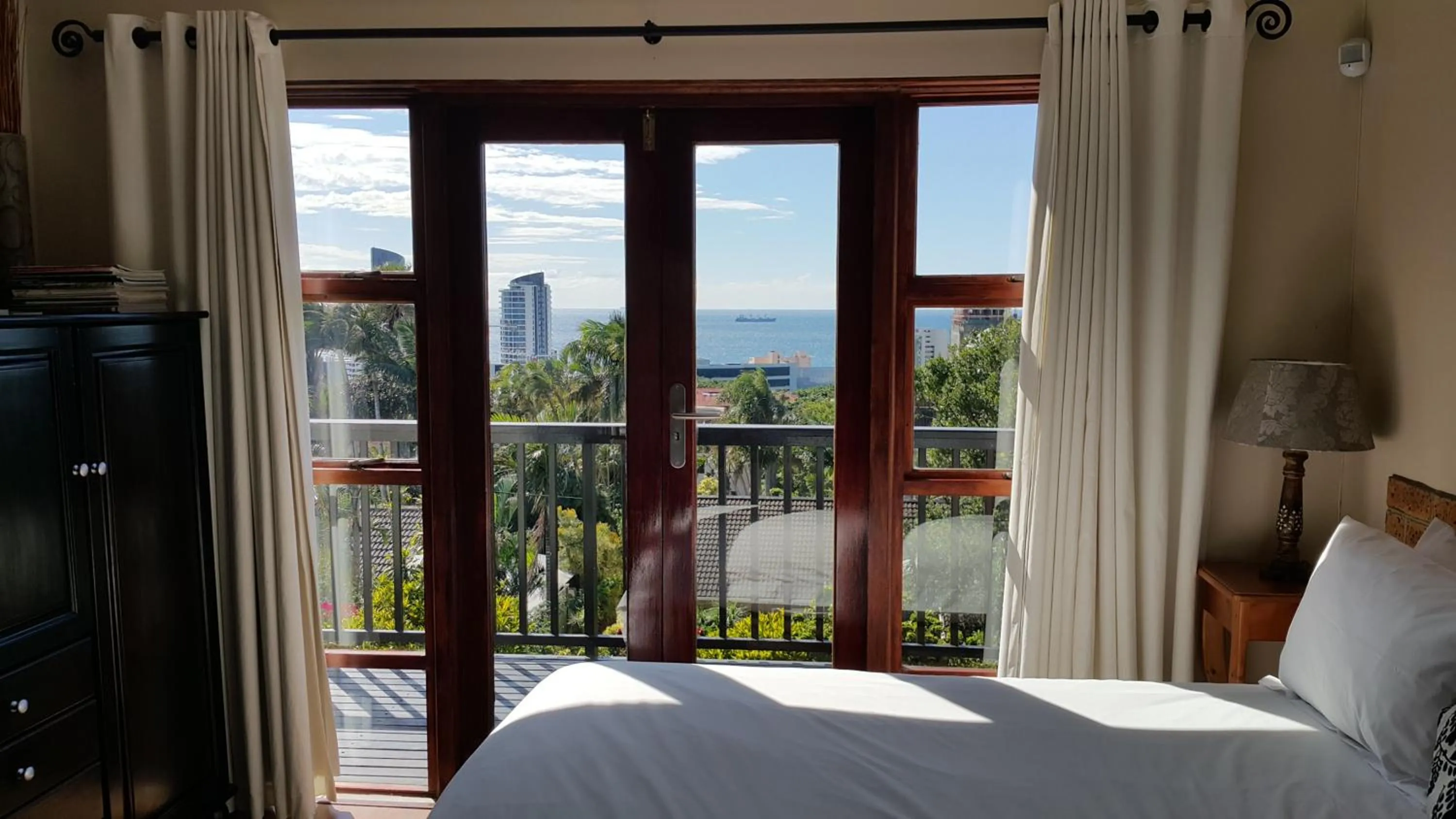 Pool view, Bed in Crooked Tree Cottage