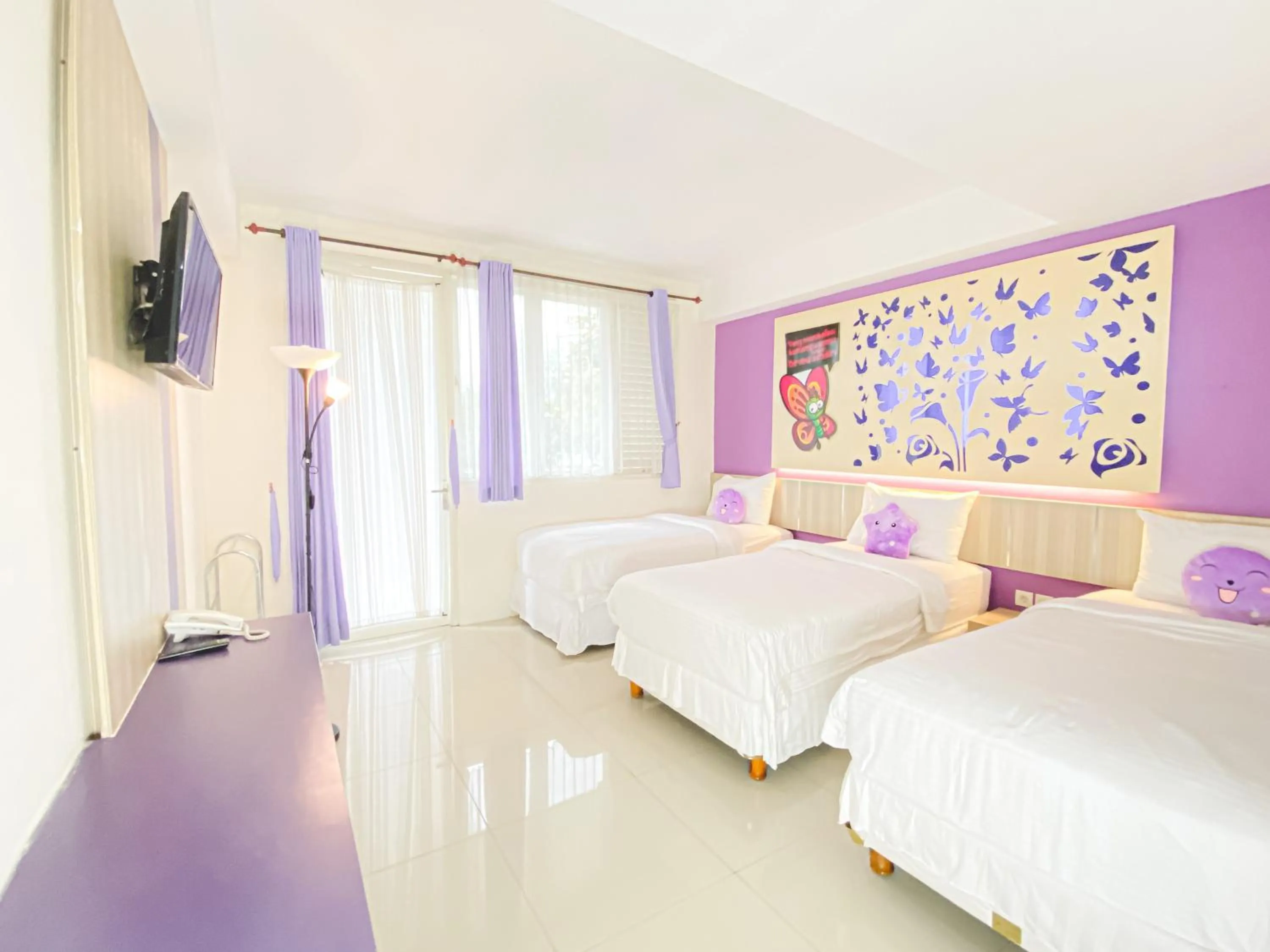 Bed in Transformer Center Hotel