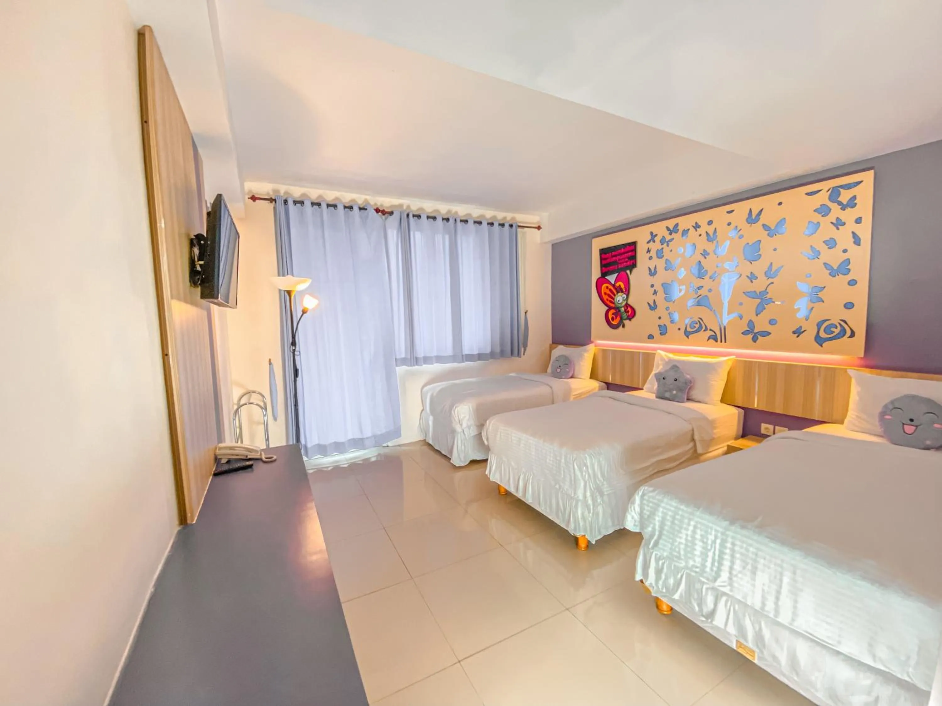 Bed in Transformer Center Hotel