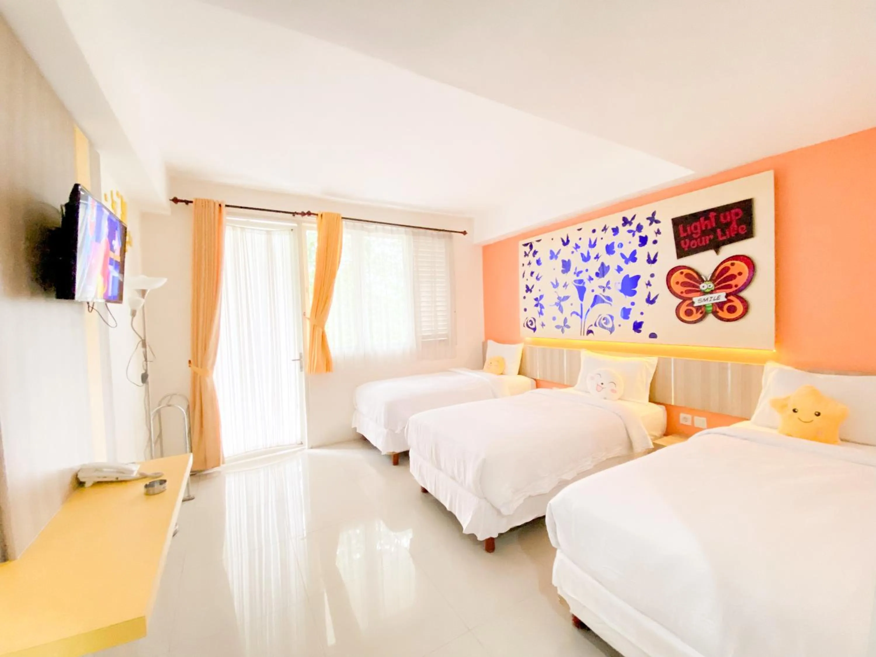 Bed in Transformer Center Hotel