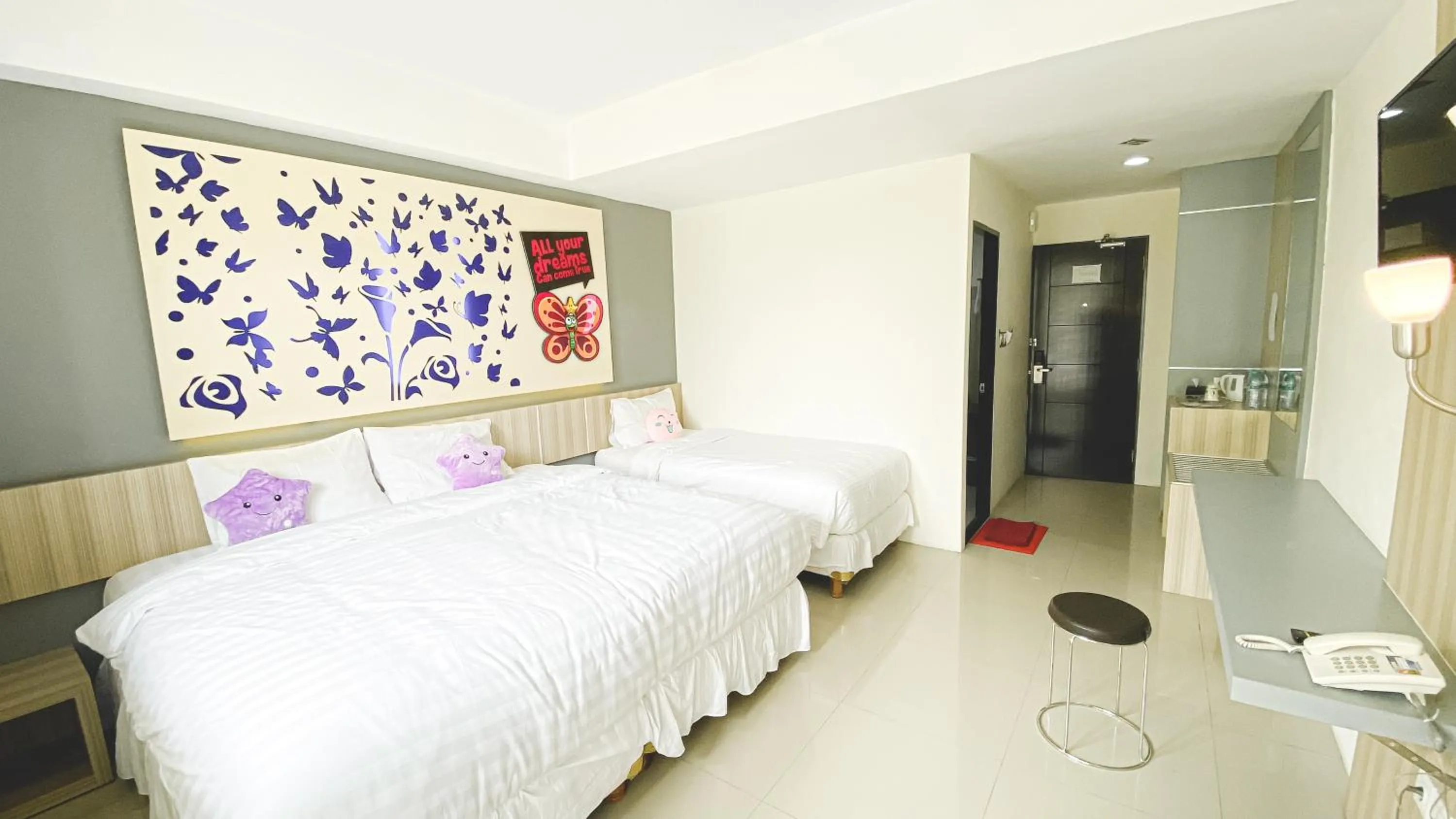 Bed in Transformer Center Hotel