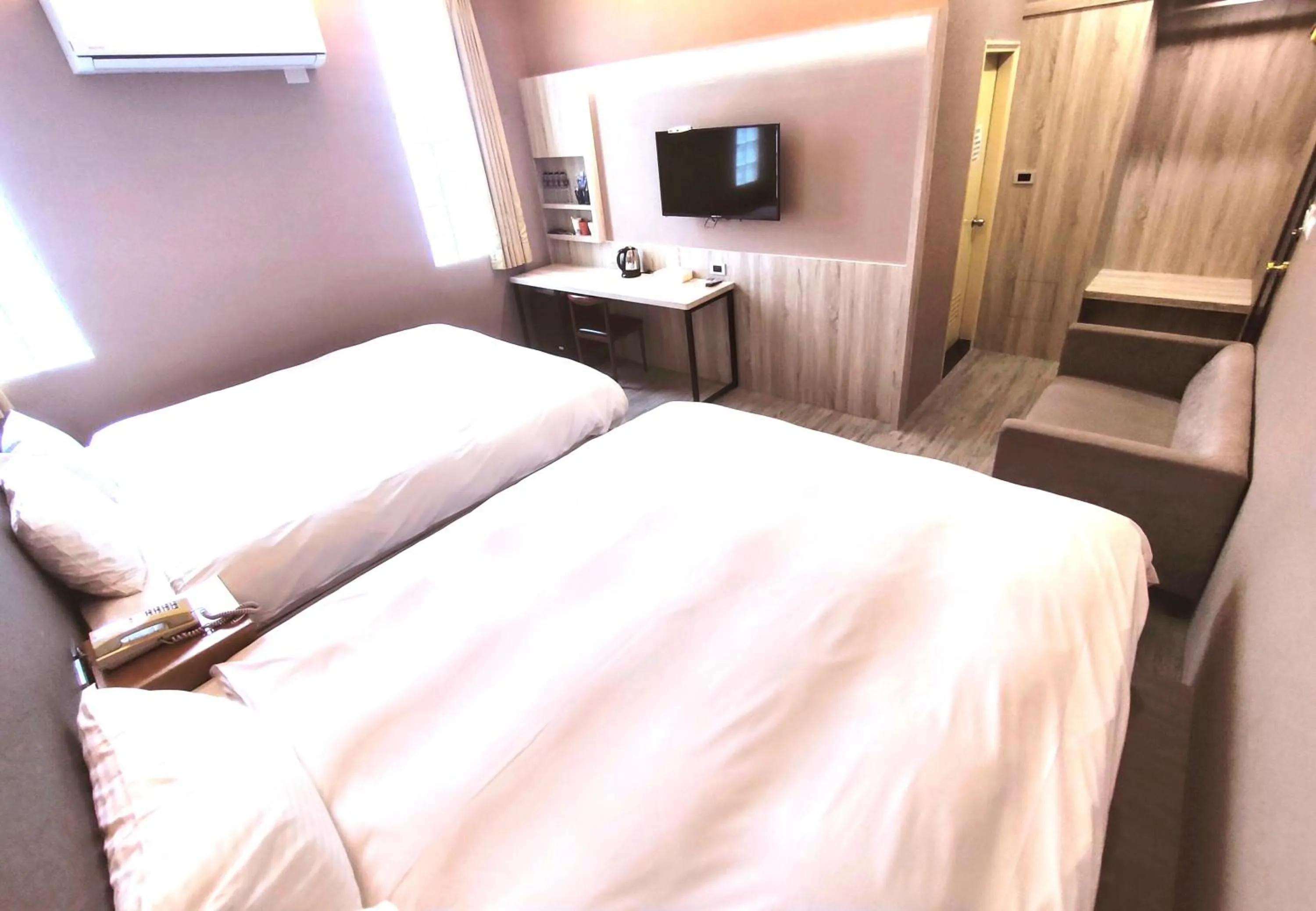 Bed in AOIKE Hot Spring Hotel