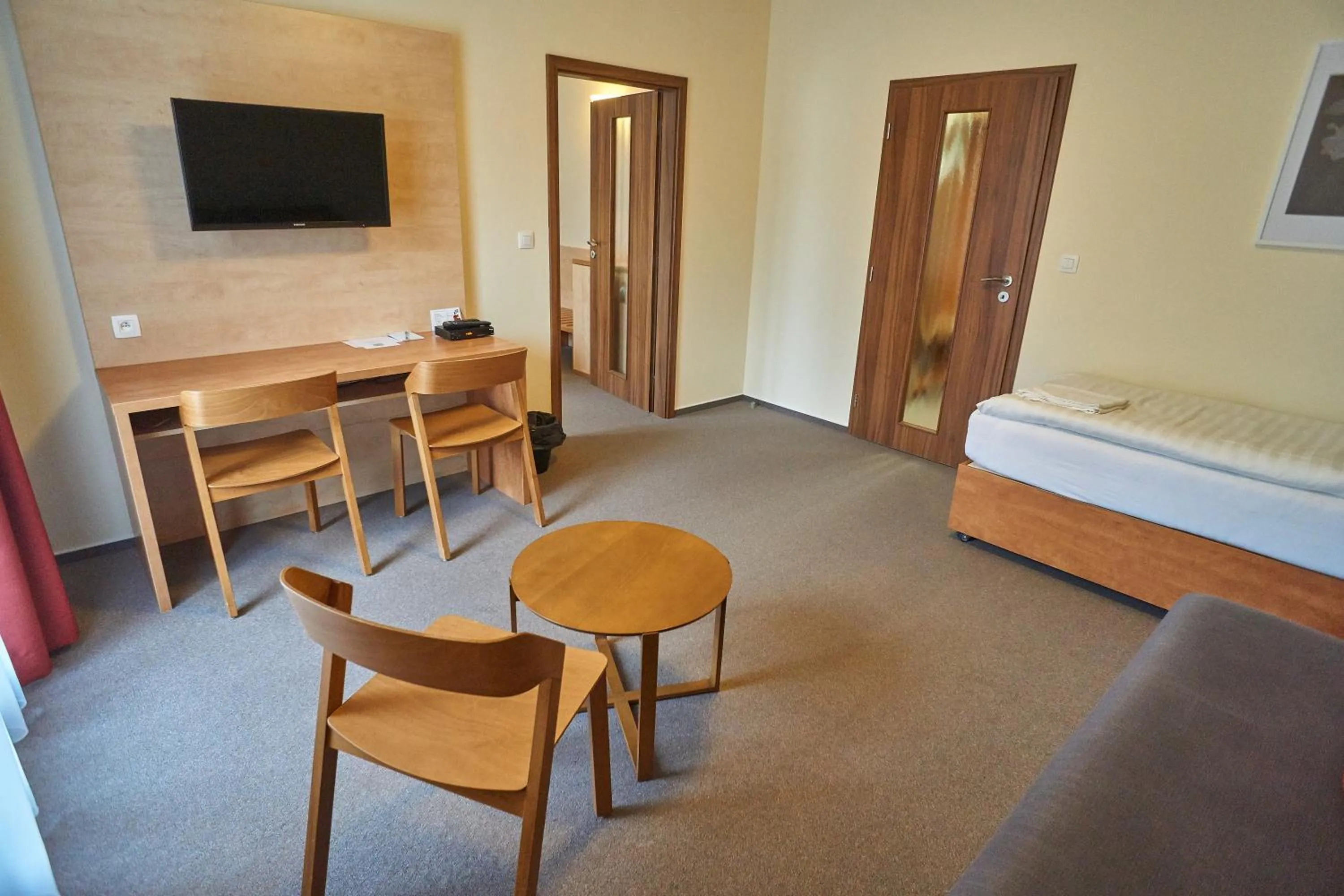 Seating area, Bed in Hotel Toč