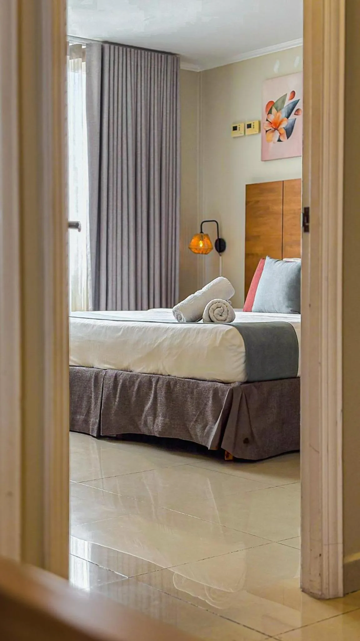 Bed in Majestic City Suites & Beach Hotel