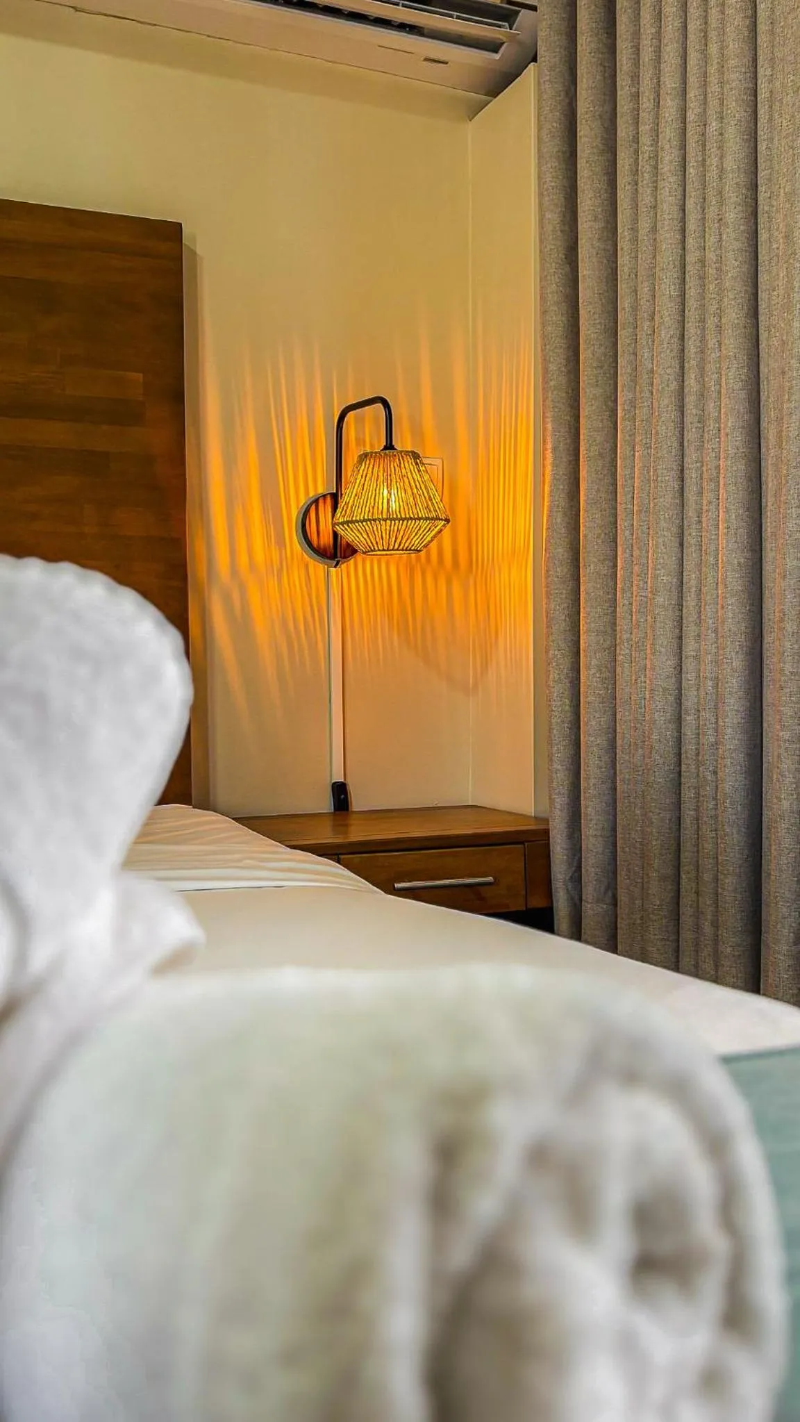 Bed in Majestic City Suites & Beach Hotel