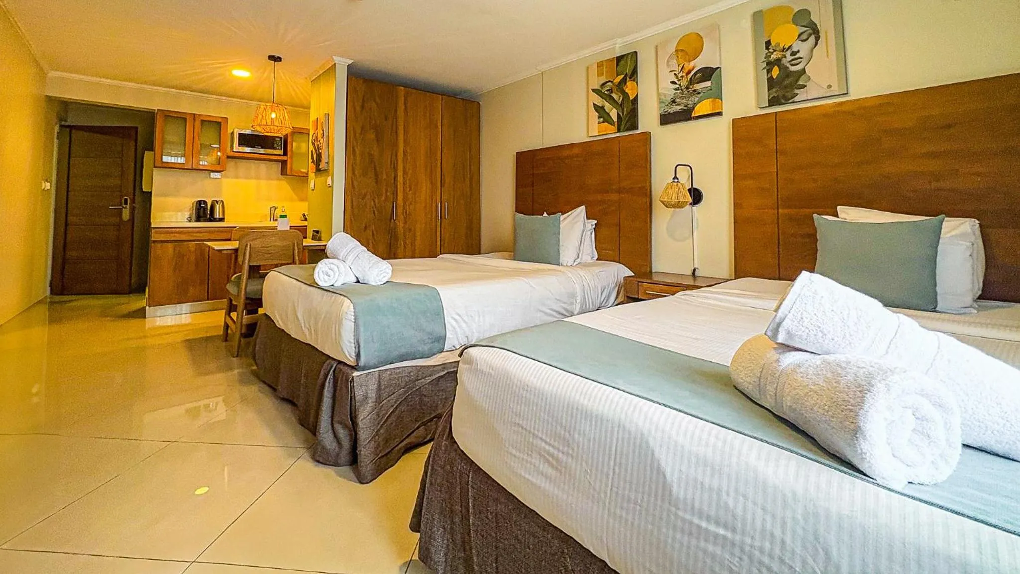 Bed in Majestic City Suites & Beach Hotel