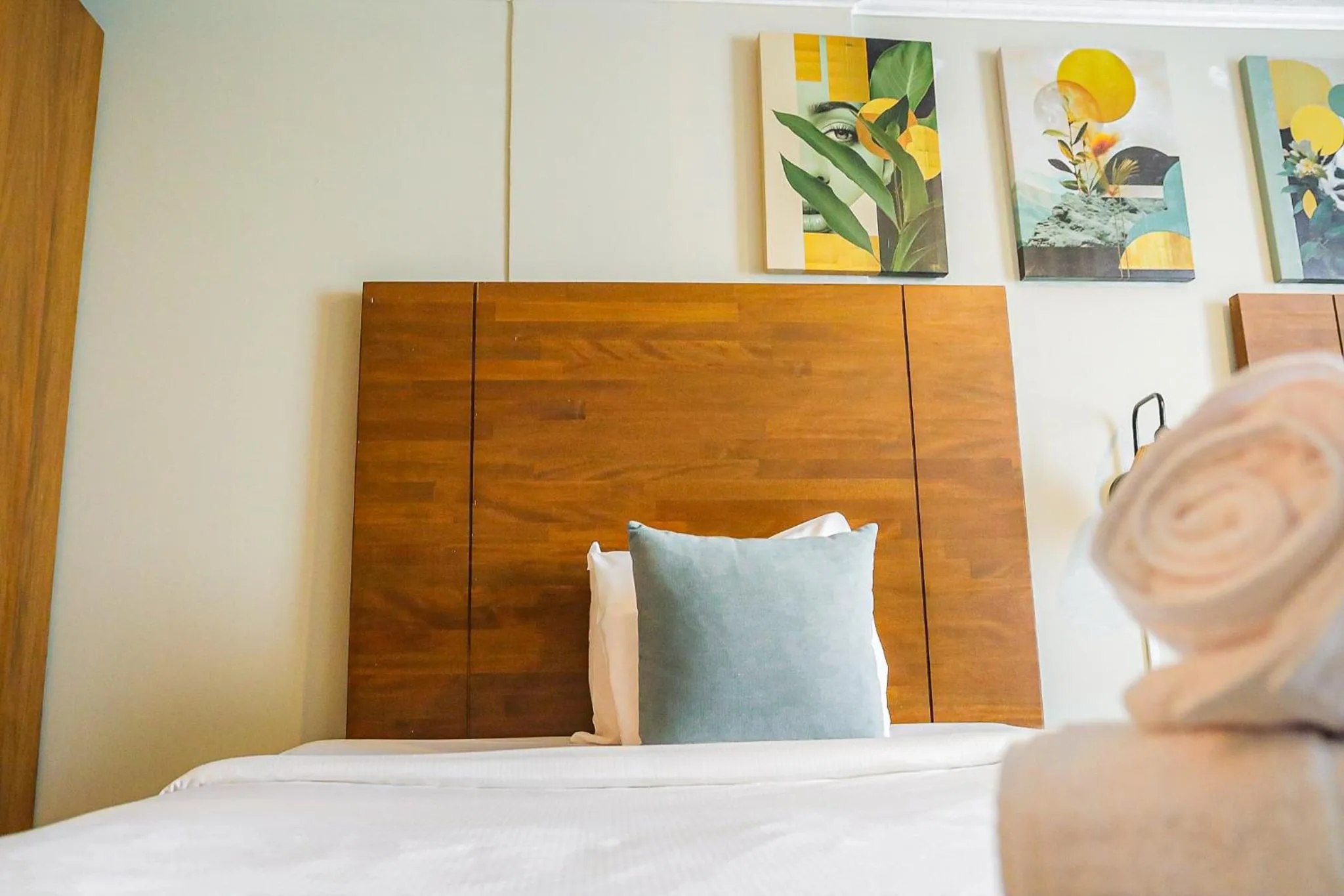 Bed in Majestic City Suites & Beach Hotel