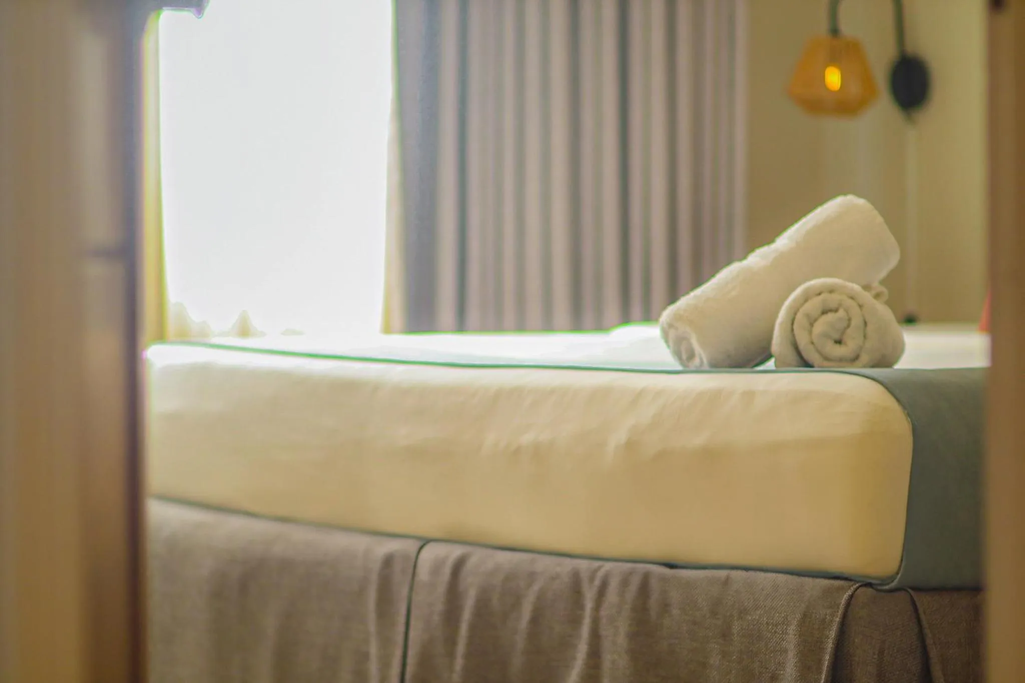 Bed in Majestic City Suites & Beach Hotel