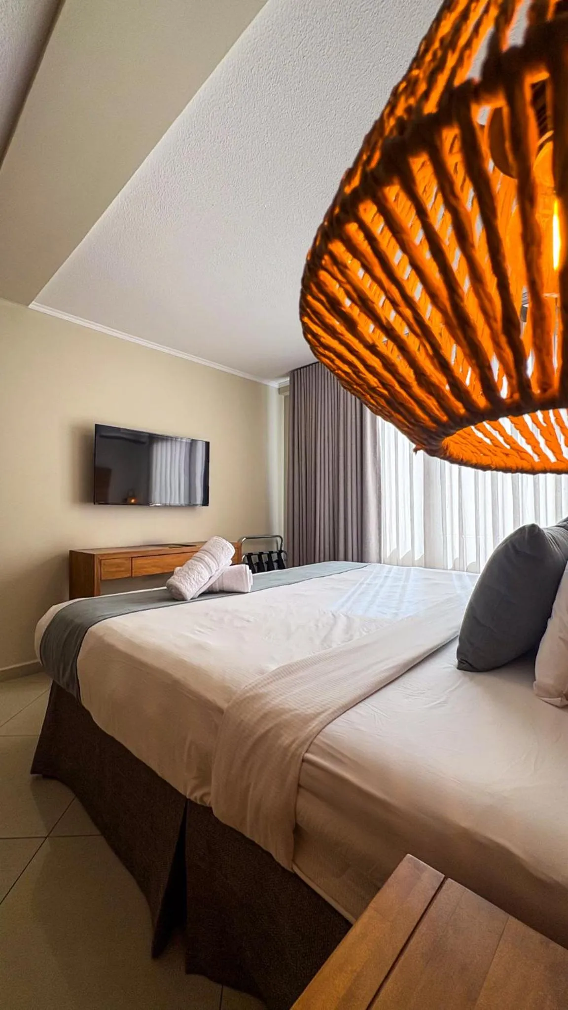 Bed in Majestic City Suites & Beach Hotel