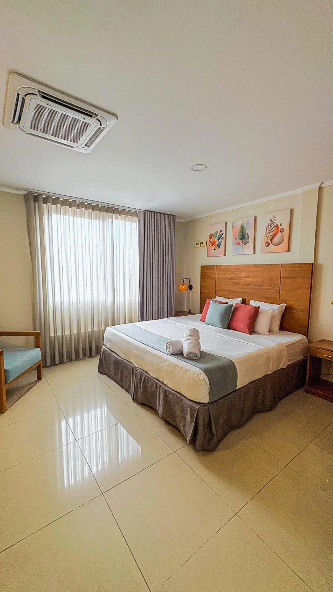 Bed in Majestic City Suites & Beach Hotel