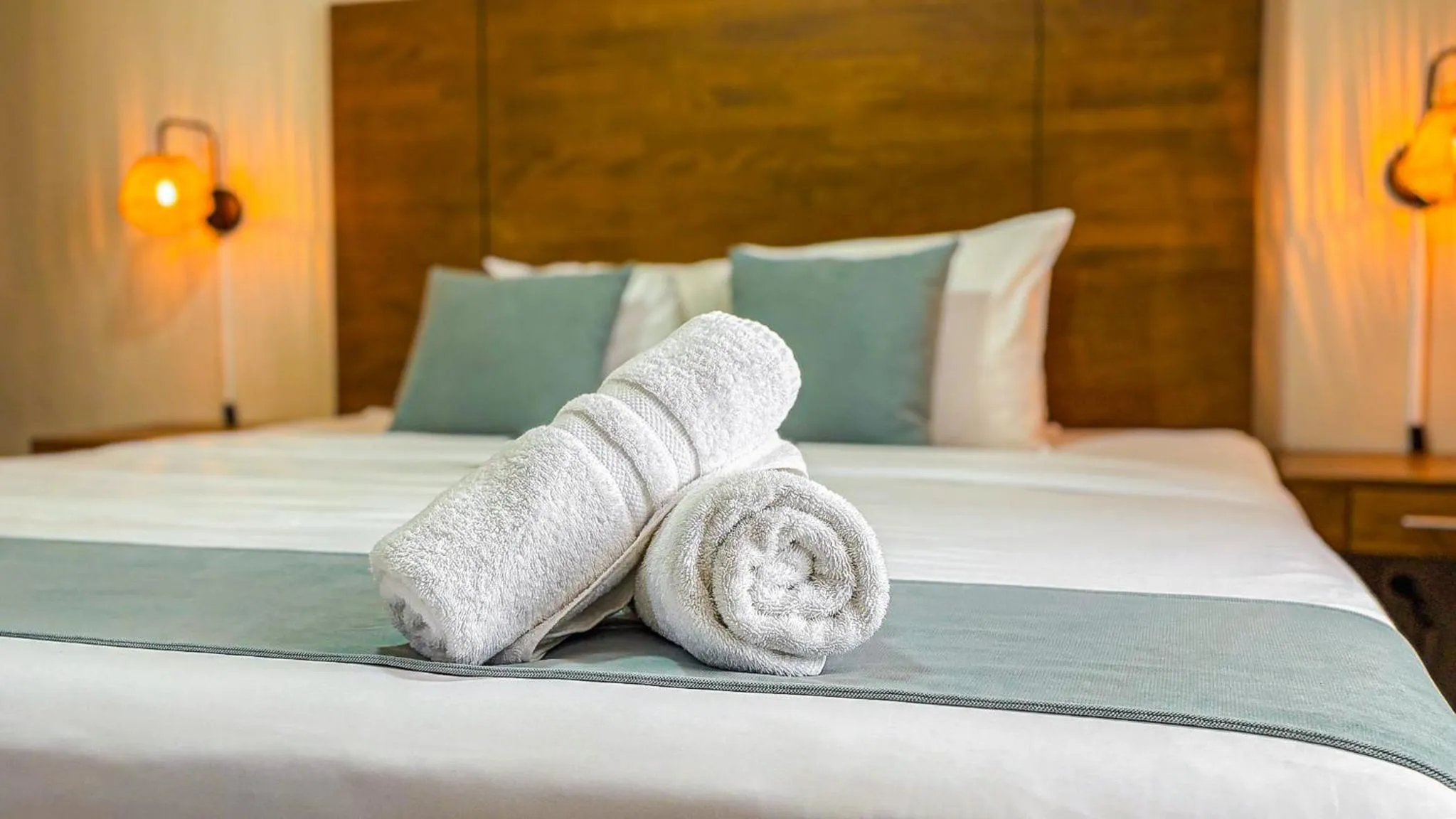 Bed in Majestic City Suites & Beach Hotel