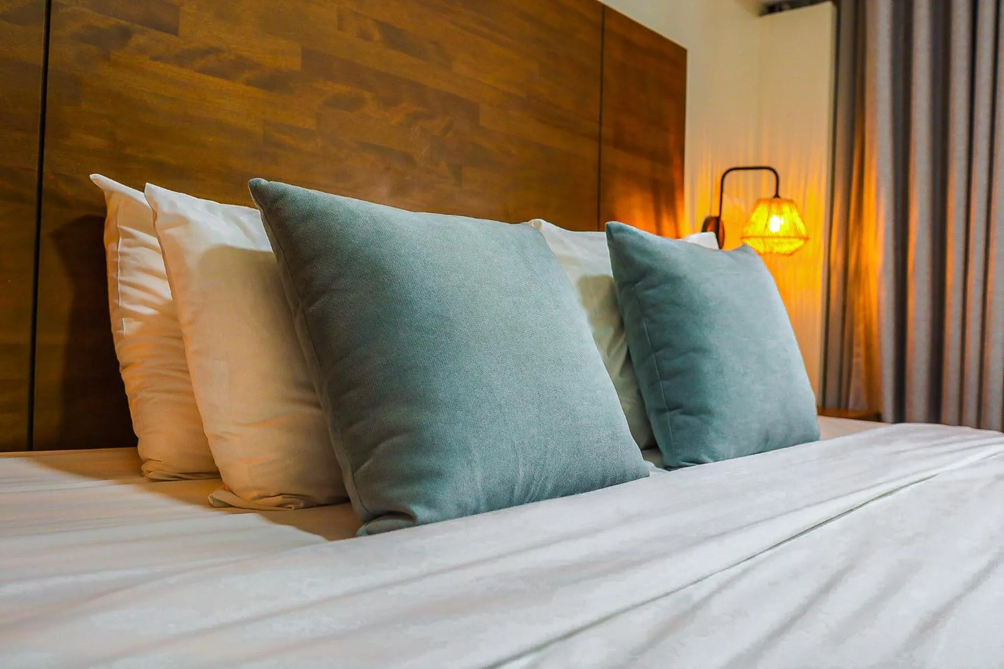 Bed in Majestic City Suites & Beach Hotel