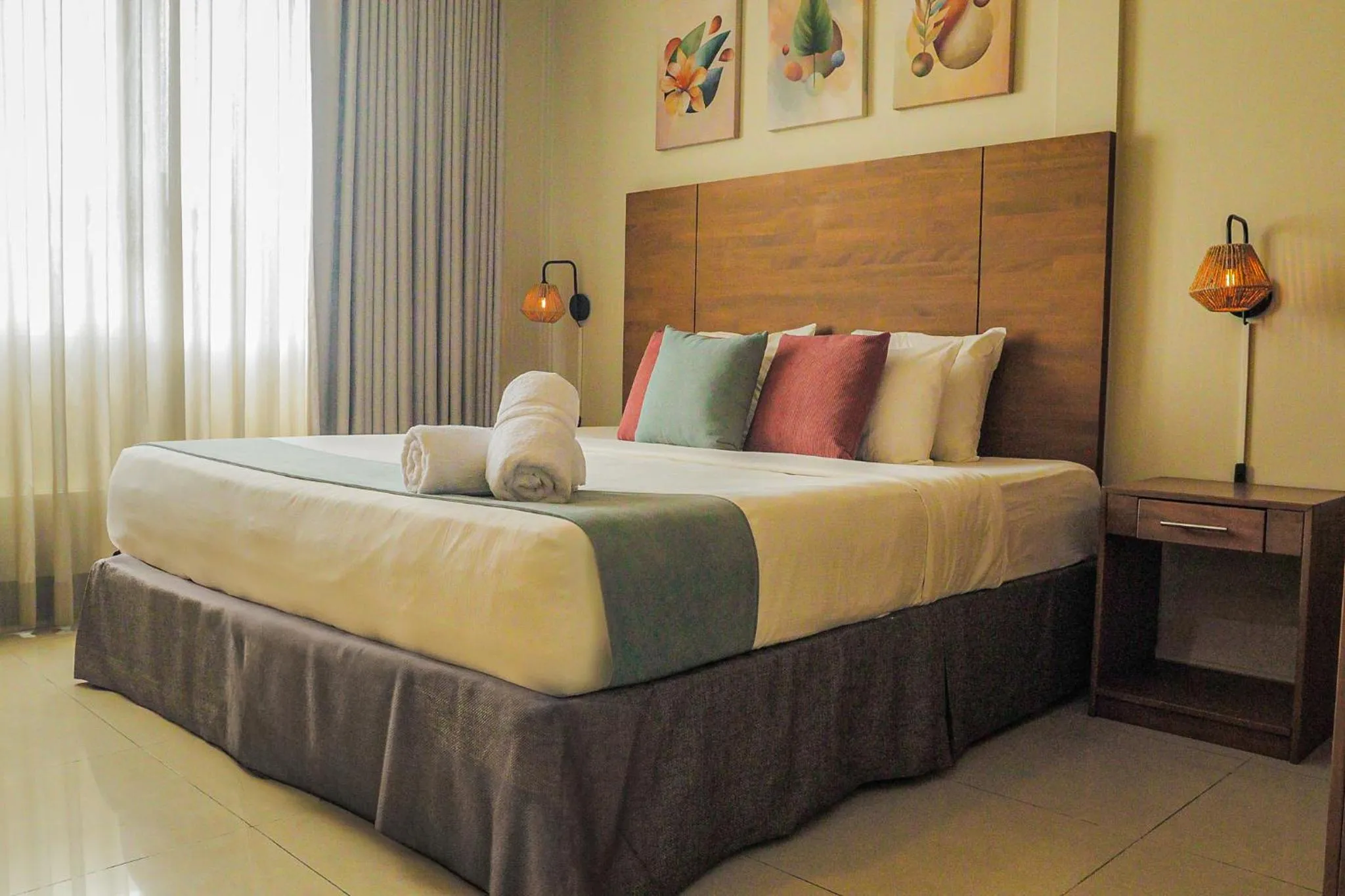 Bed in Majestic City Suites & Beach Hotel