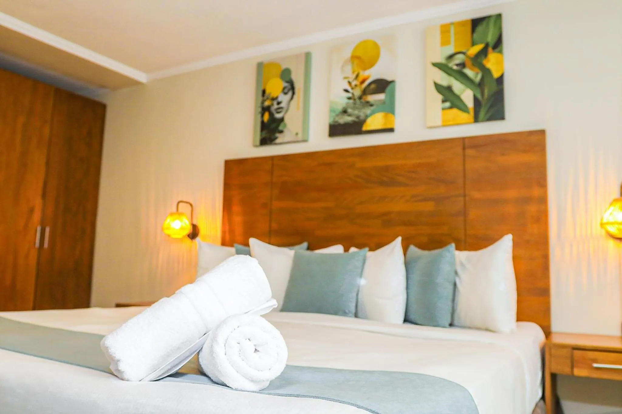 Bed in Majestic City Suites & Beach Hotel