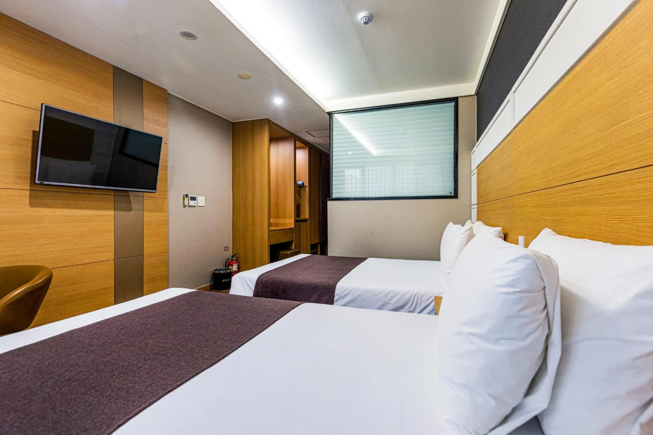 Bed in Eastern Hotel Jeju