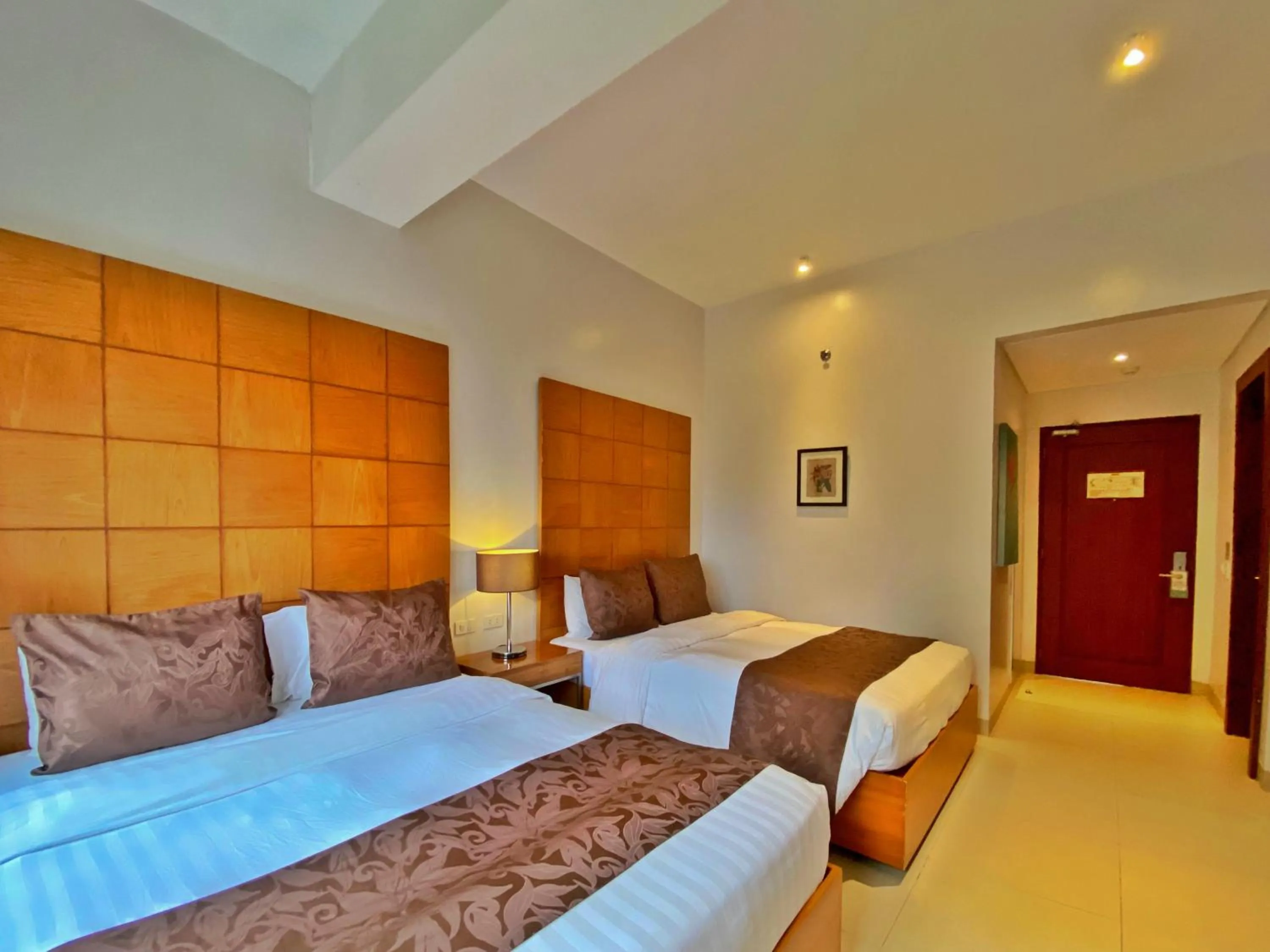 Bed in Aloha Boracay Hotel