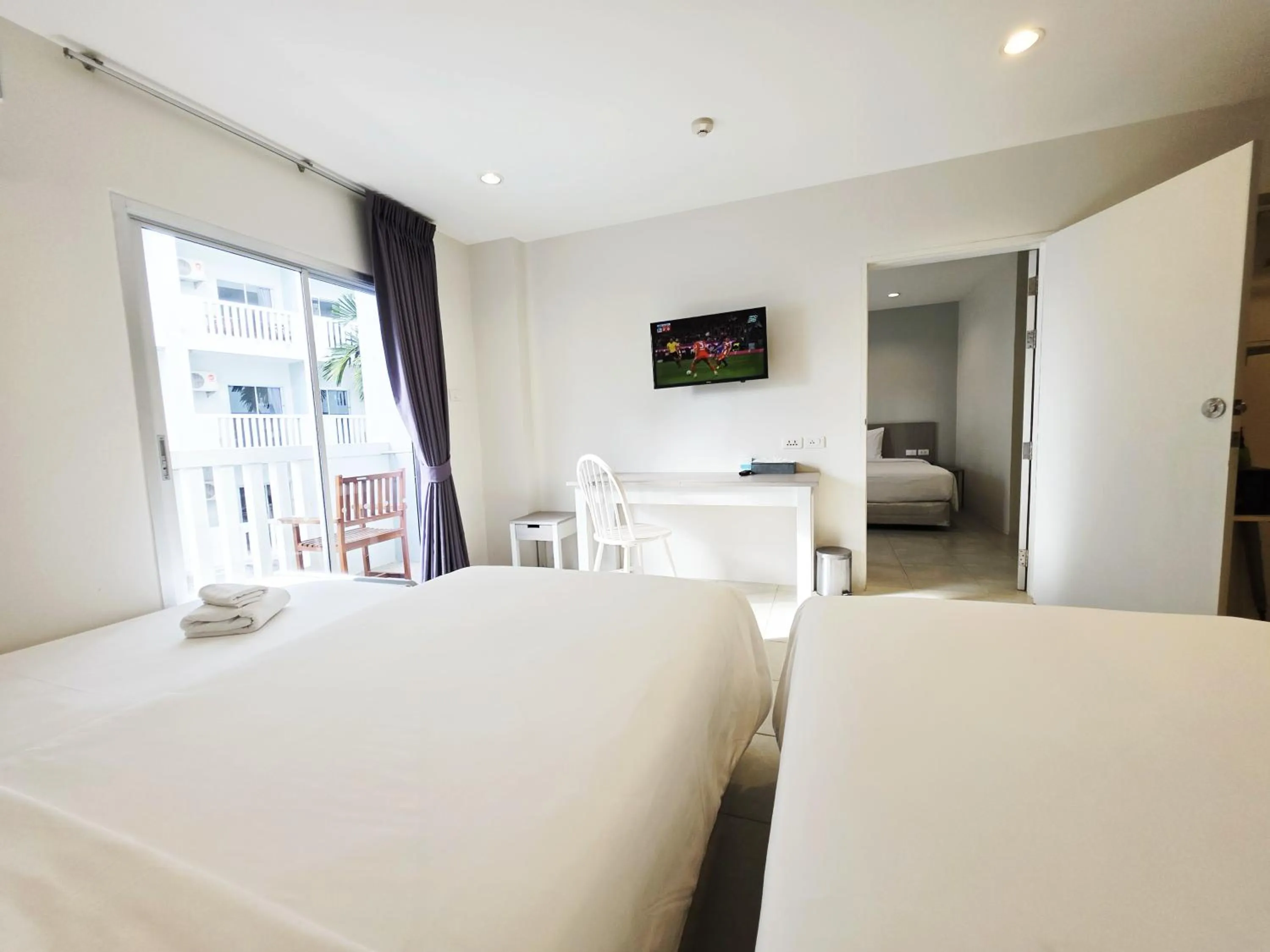 Bed in Recenta Phuket Suanluang by Deevana