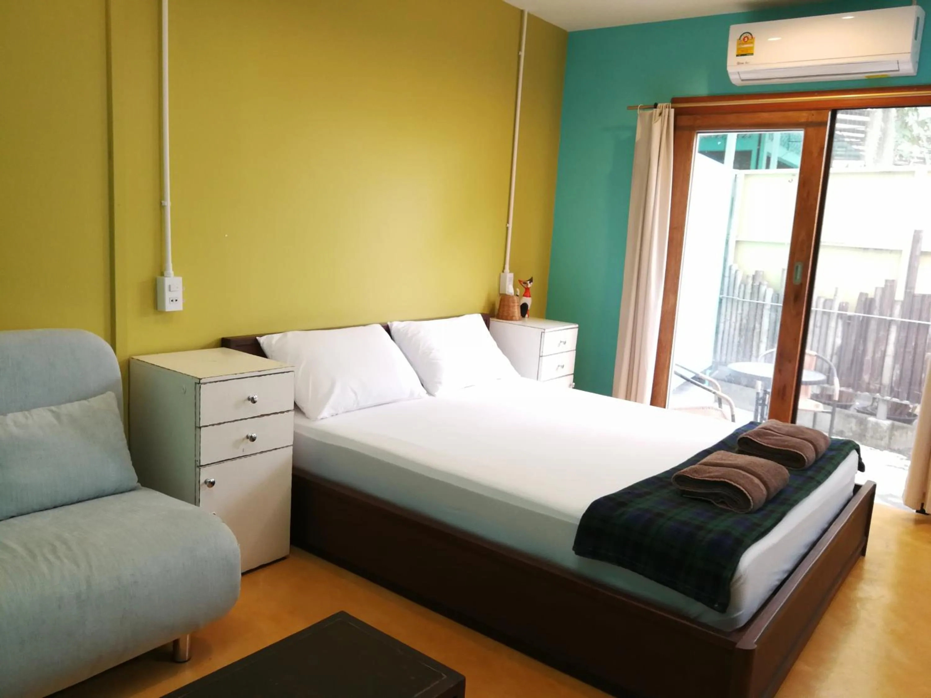 Bedroom, Bed in 60 Blue House