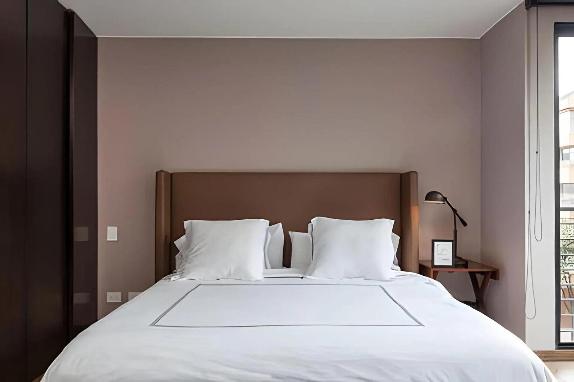 Bed in Attik Luxury Apts