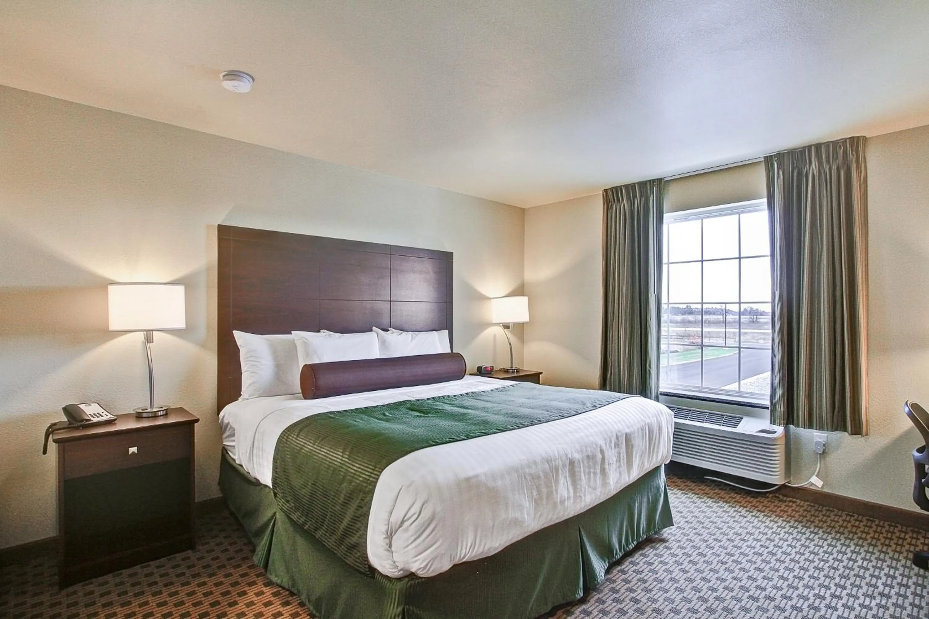 Bed in Castle Rock Inn & Suites - Quinter