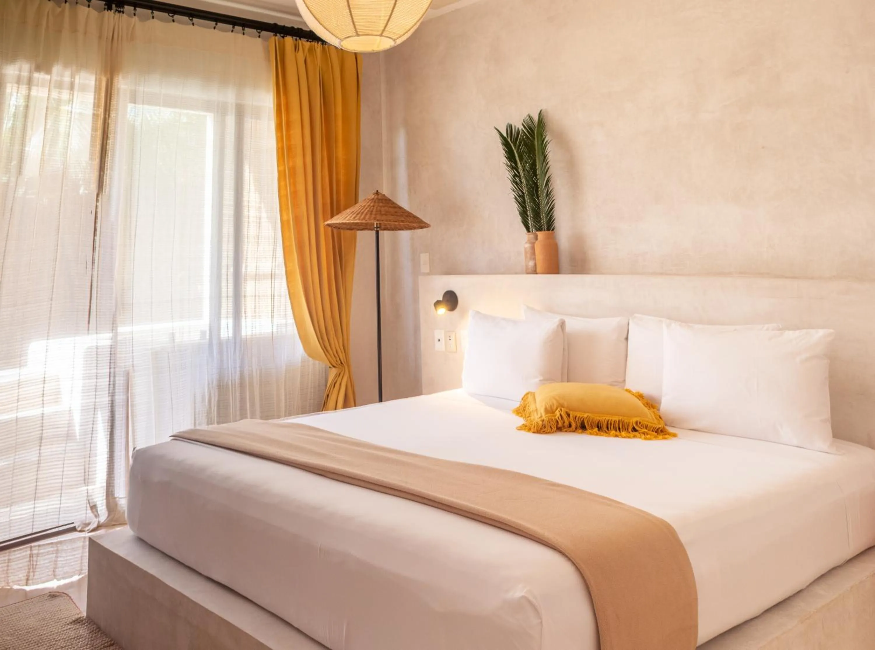 Bed in Dune Boutique Hotel located at the party zone