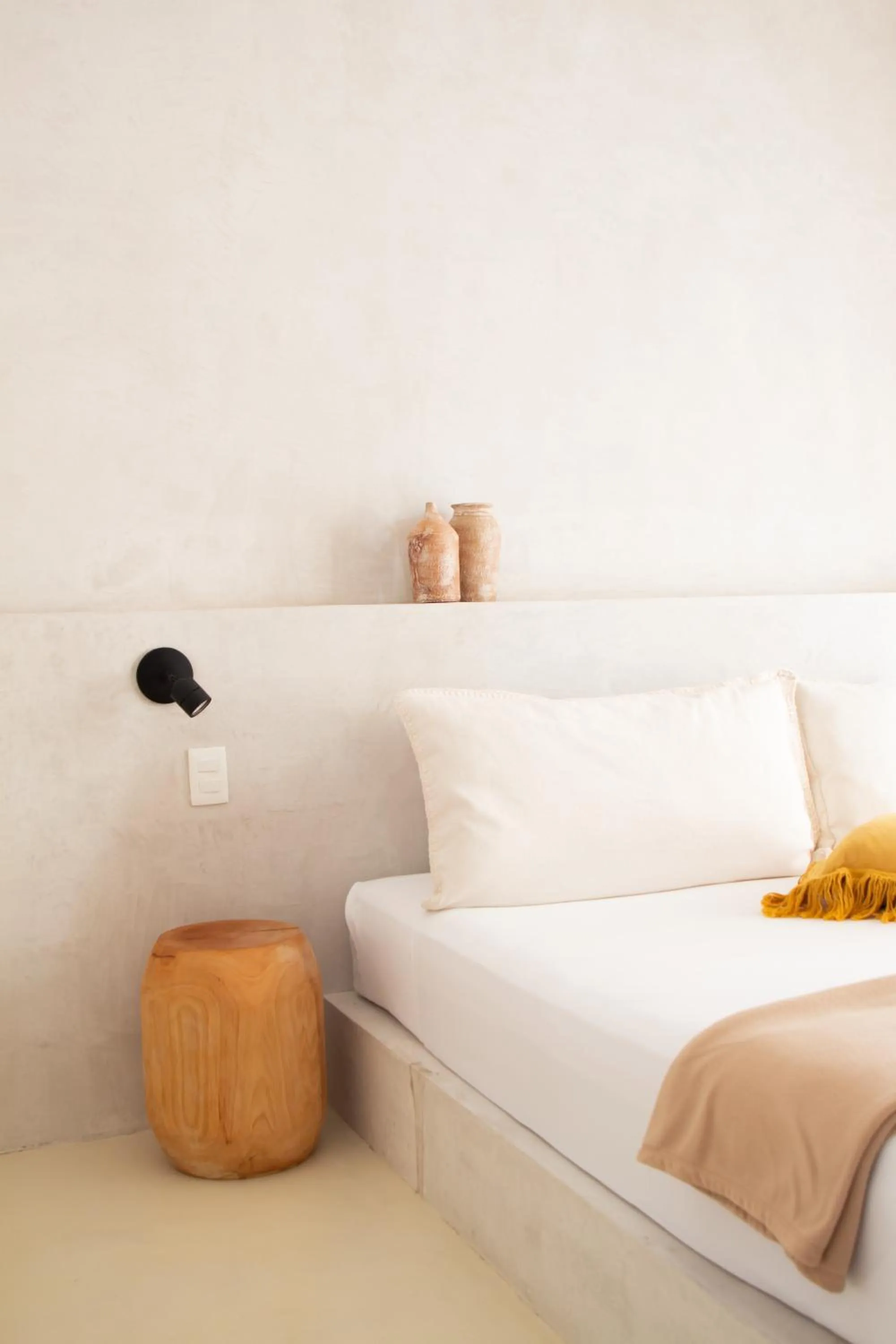 Bed in Dune Boutique Hotel located at the party zone