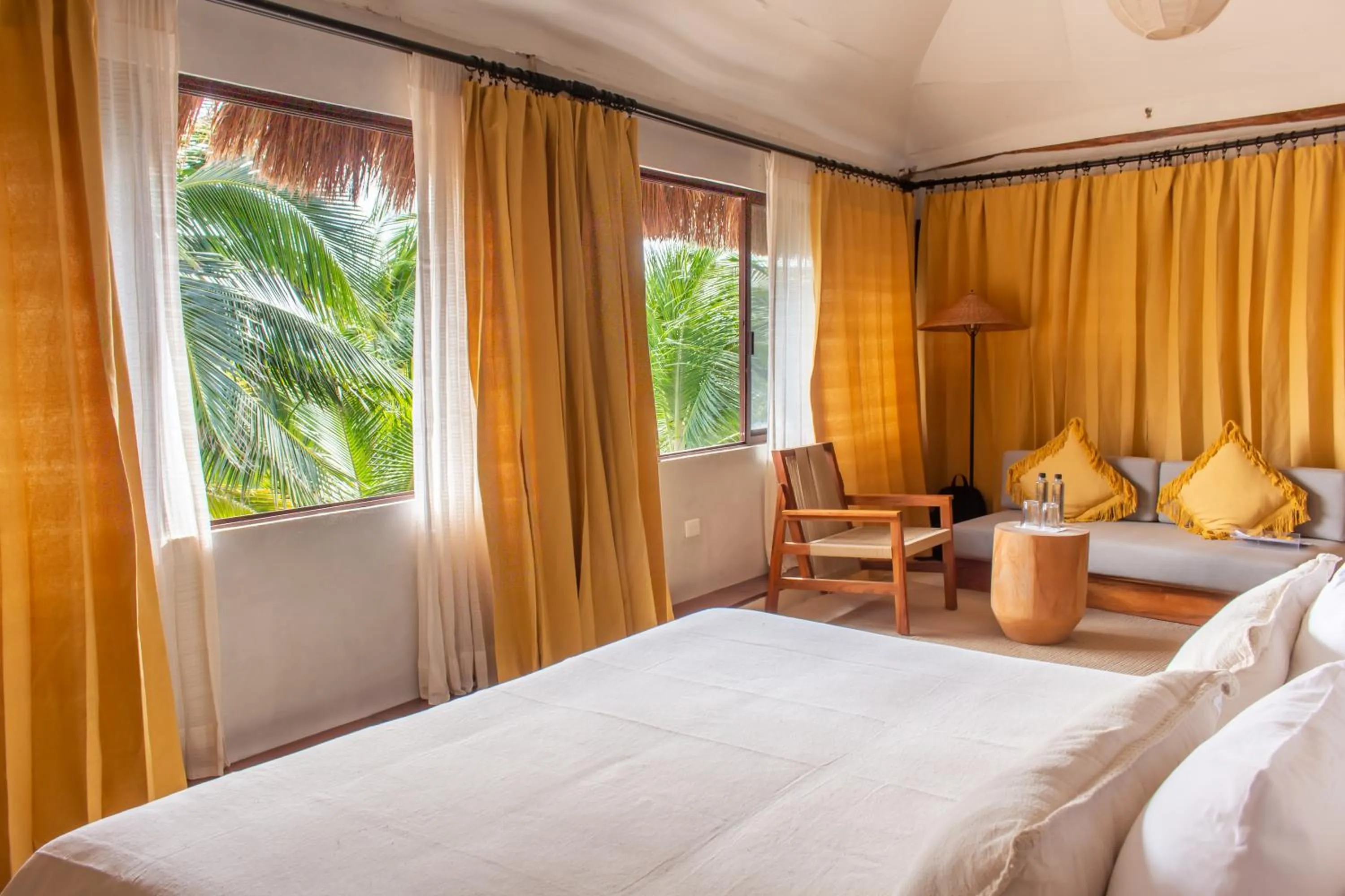 Bed in Dune Boutique Hotel located at the party zone