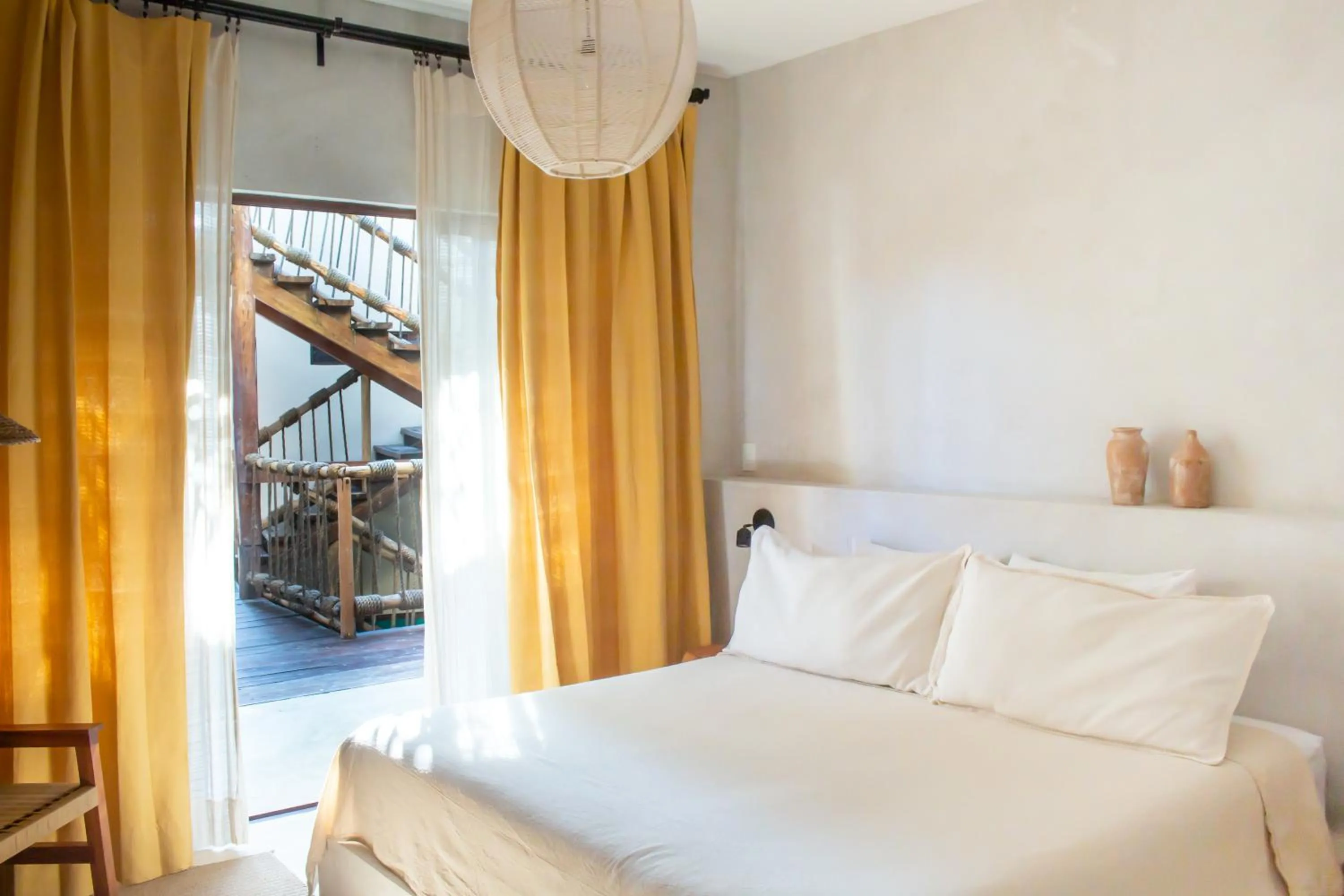 Bed in Dune Boutique Hotel located at the party zone