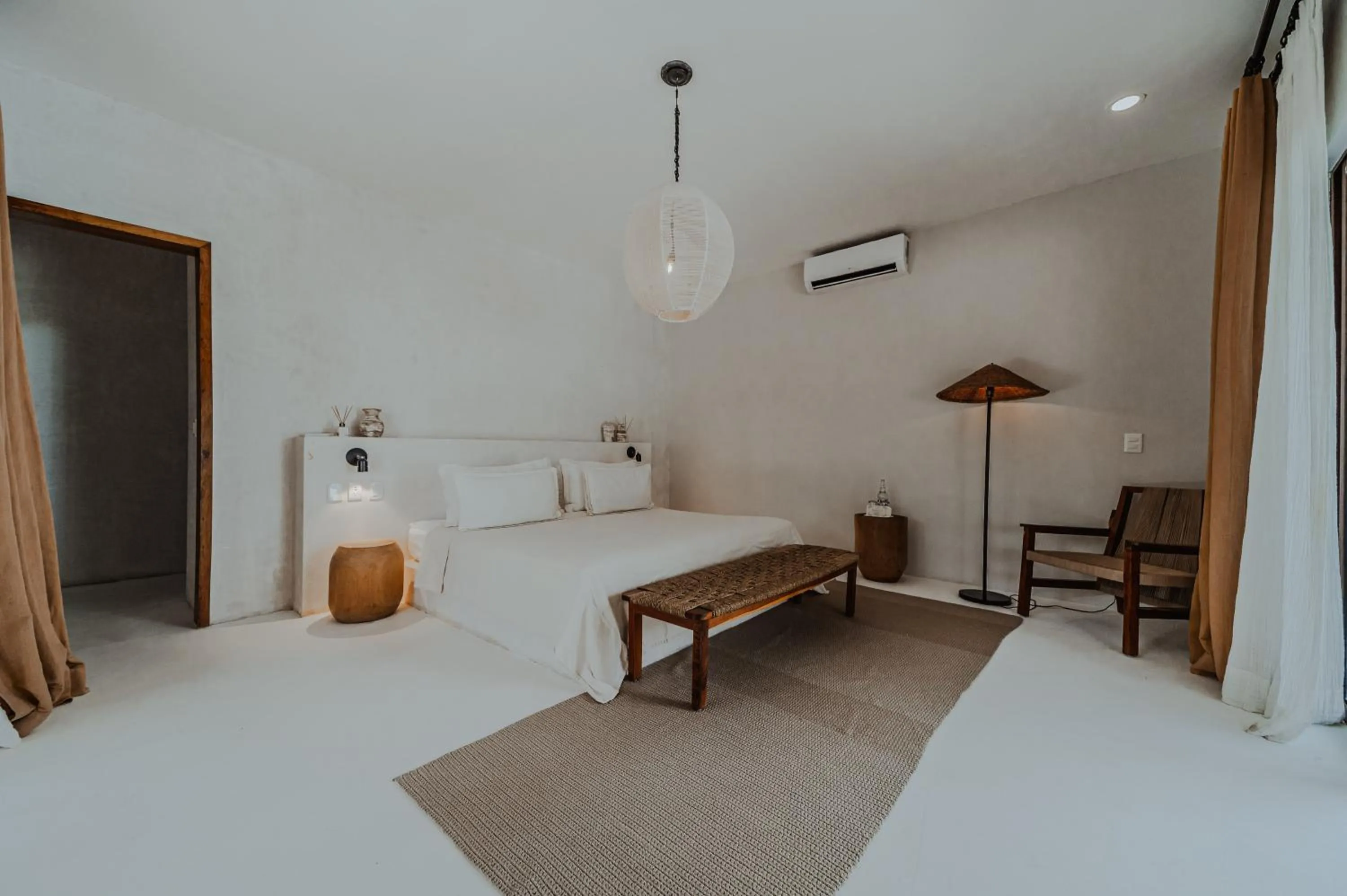 Bed in Dune Boutique Hotel located at the party zone