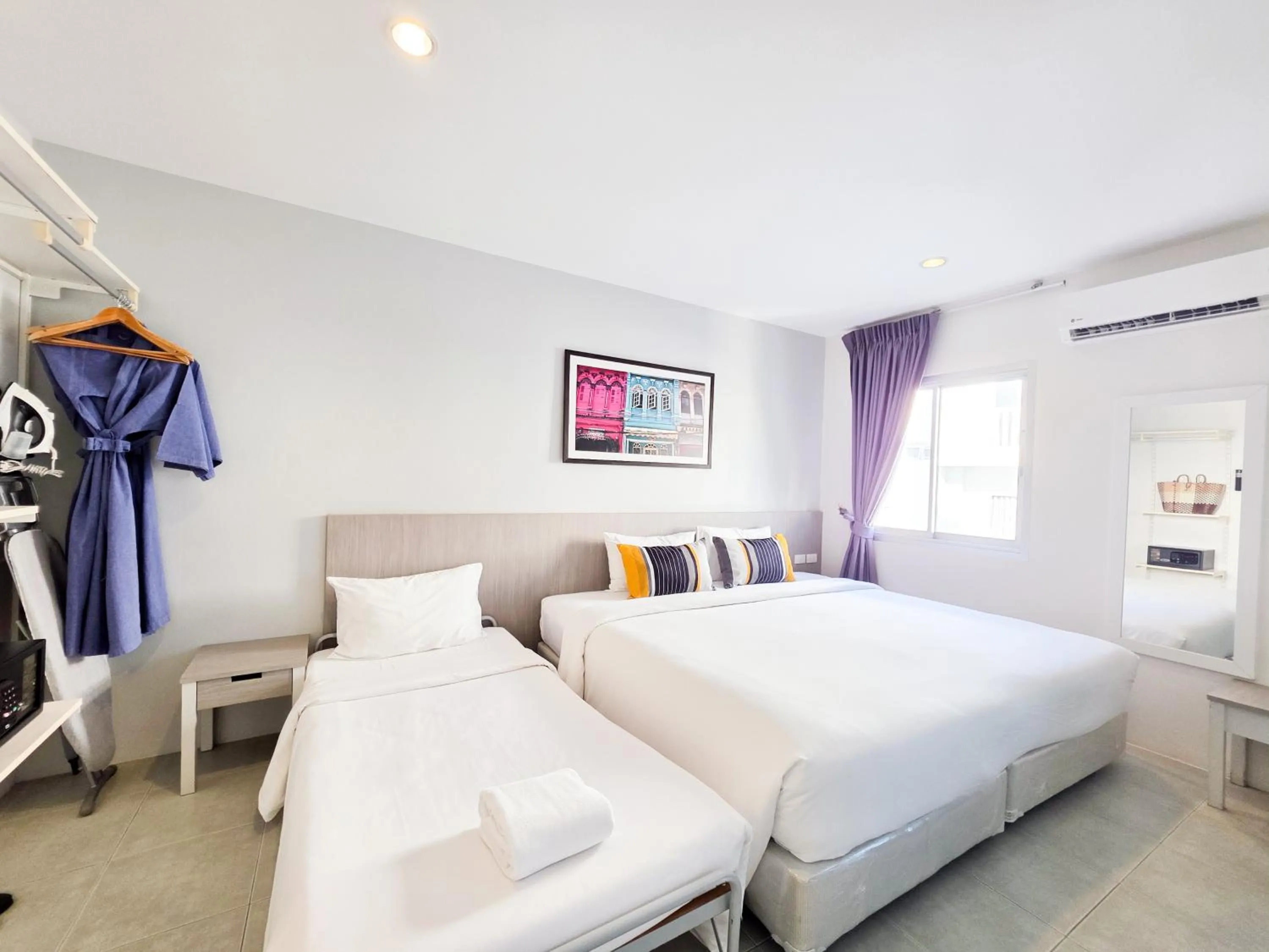 Bed in Recenta Suite Phuket Suanluang