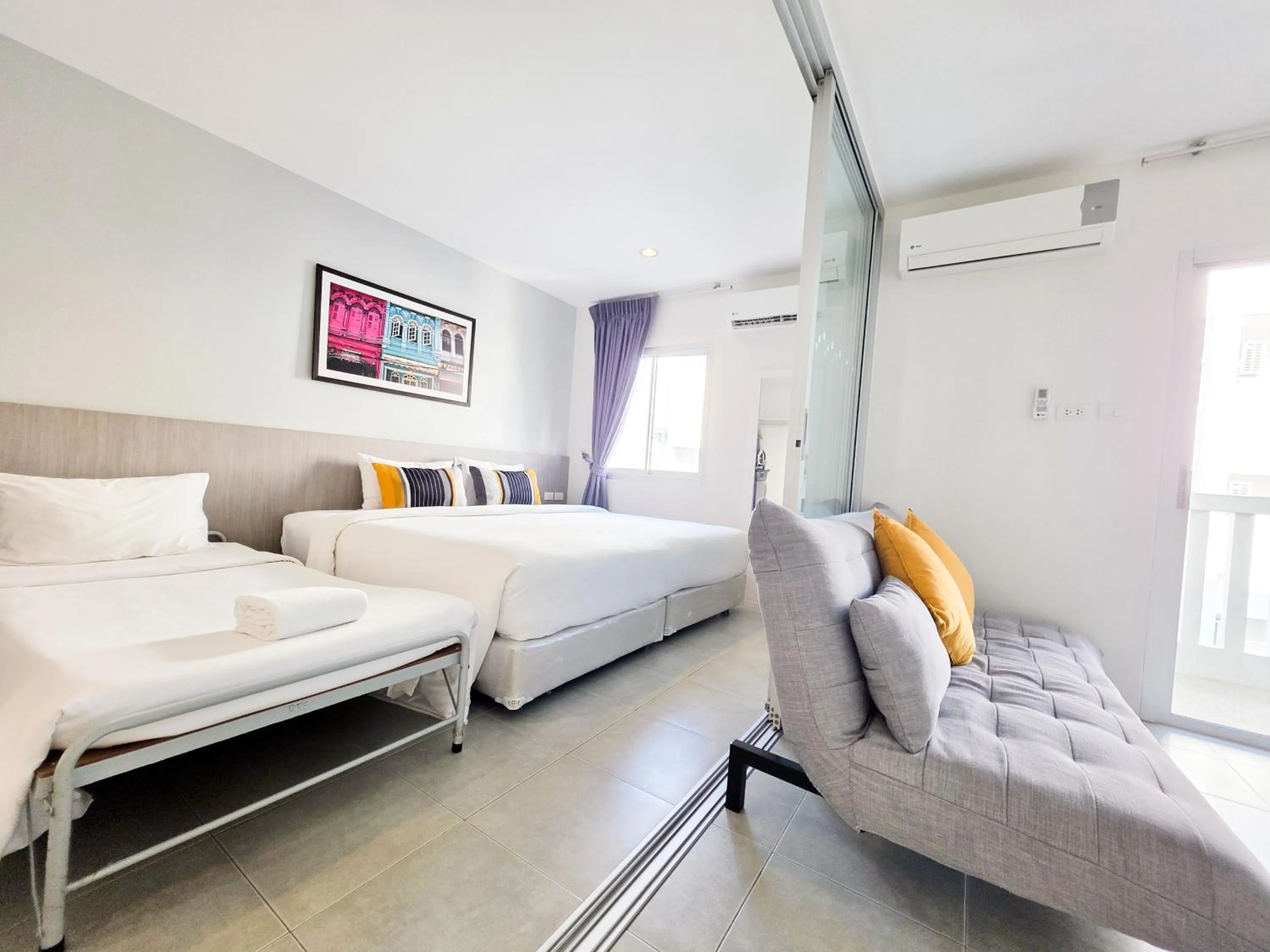 Bed in Recenta Suite Phuket Suanluang