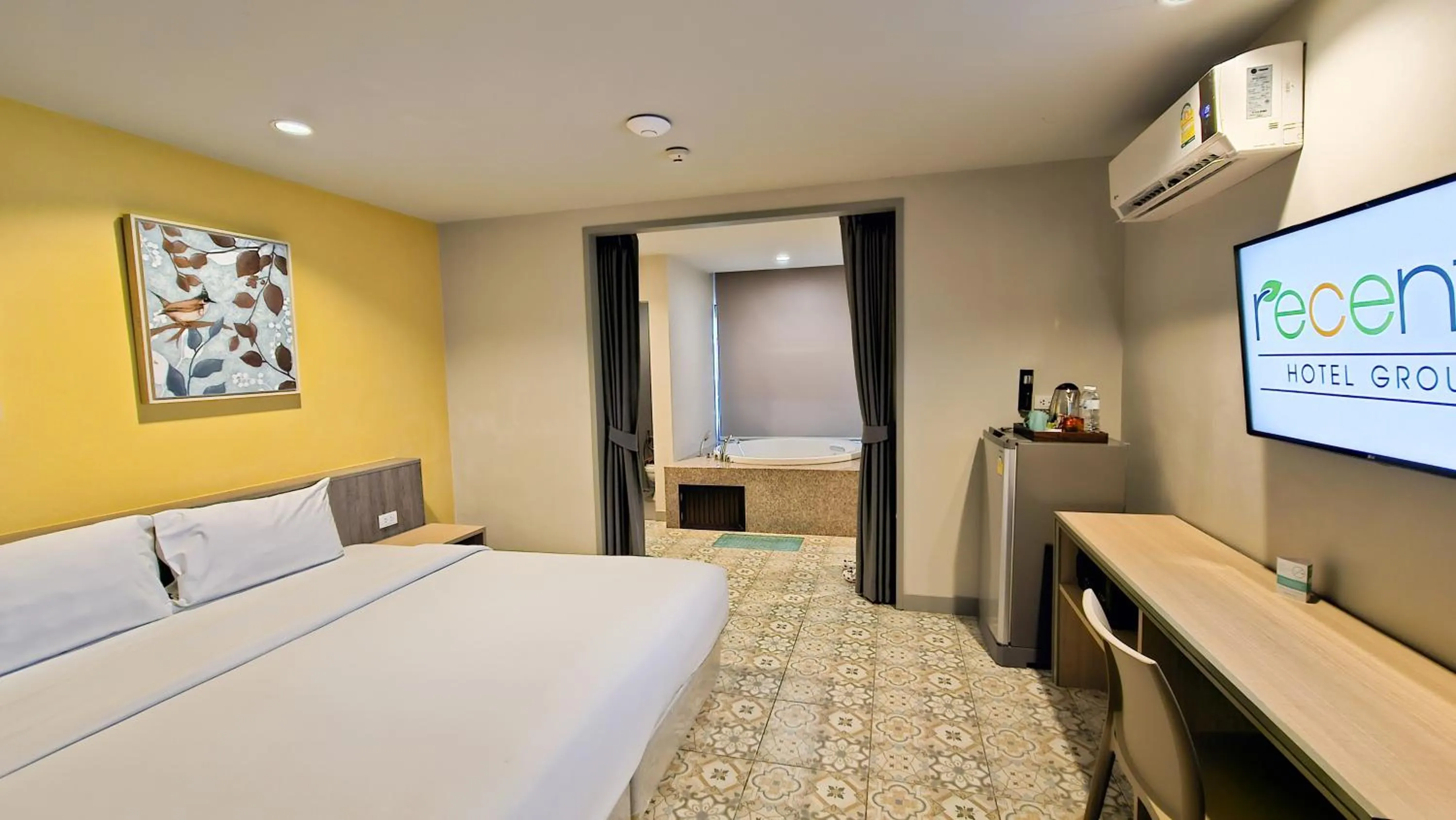 Bed in Recenta Suite Phuket Suanluang