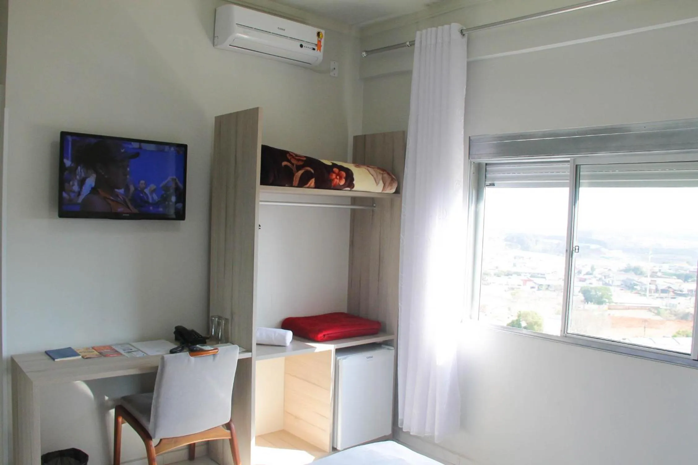 TV and multimedia in AJ Hotel Chapecó - Fácil Acesso Pátio Shopping e Rótula da Bandeira