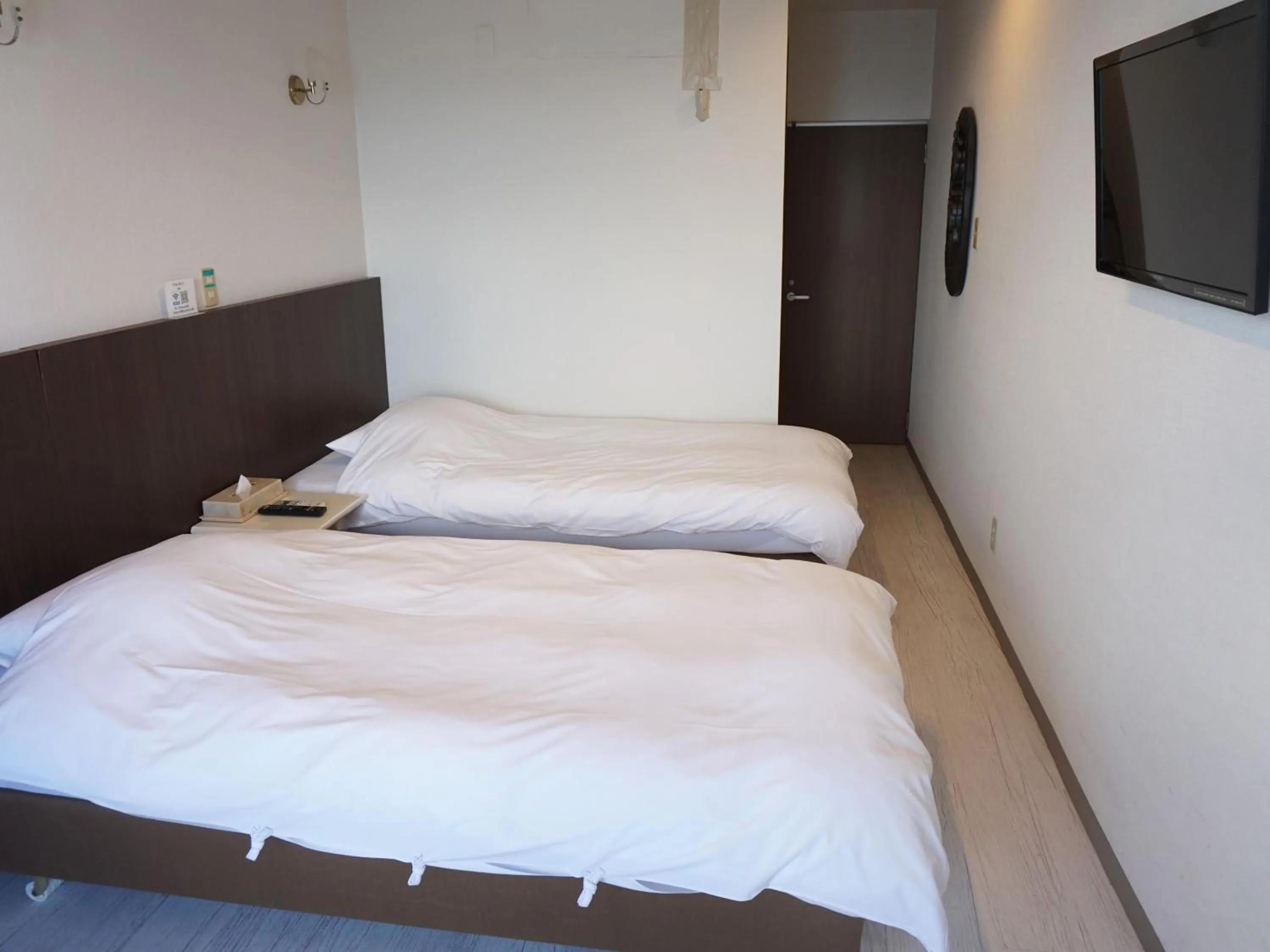 Photo of the whole room, Bed in Hotel Oceans Nakijin