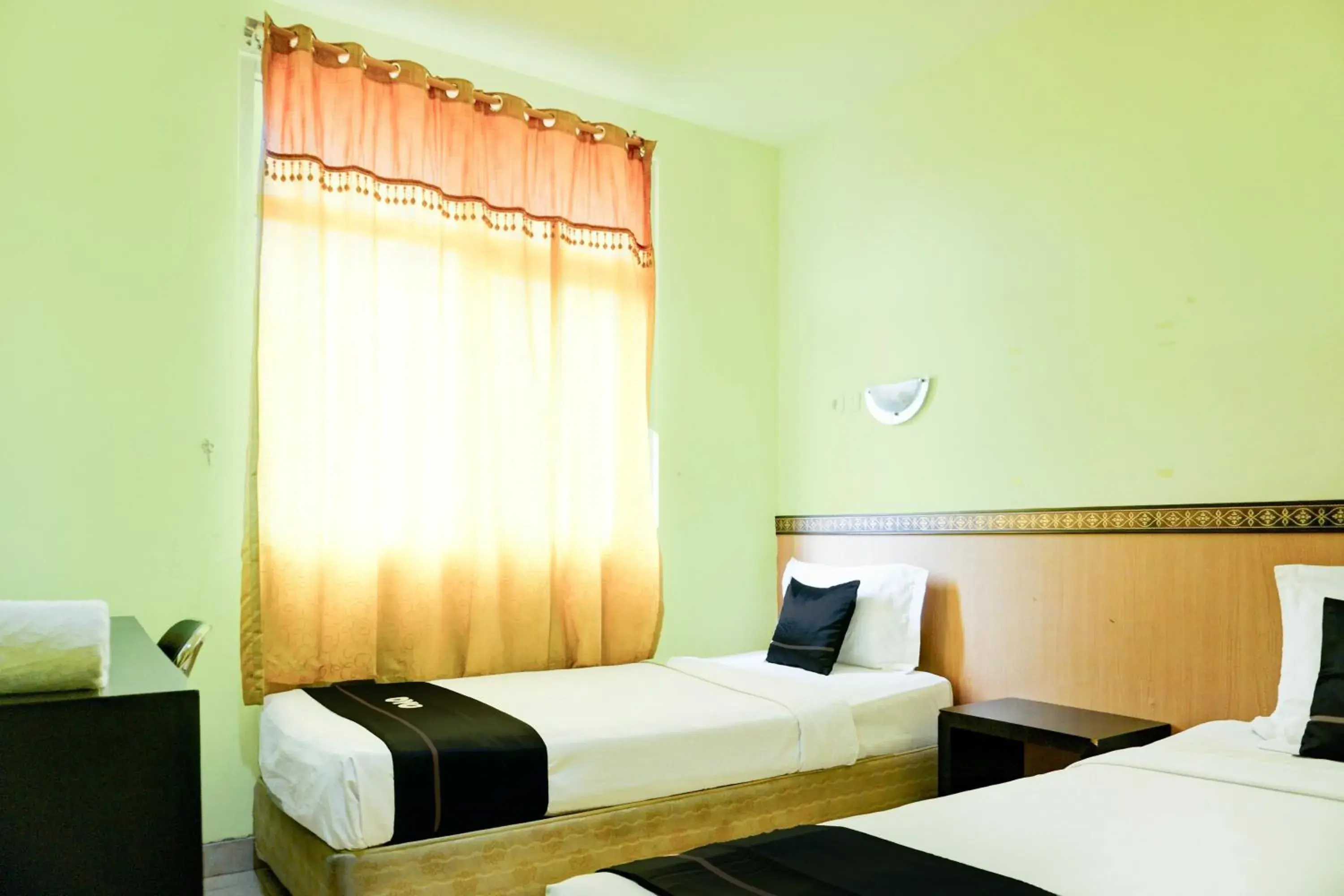 Standard Twin Room in Collection O R.Sukamto Near Palembang Trade Center Mall Standard Twin Room in Collection O R.Sukamto Near Palembang Trade Center Mall