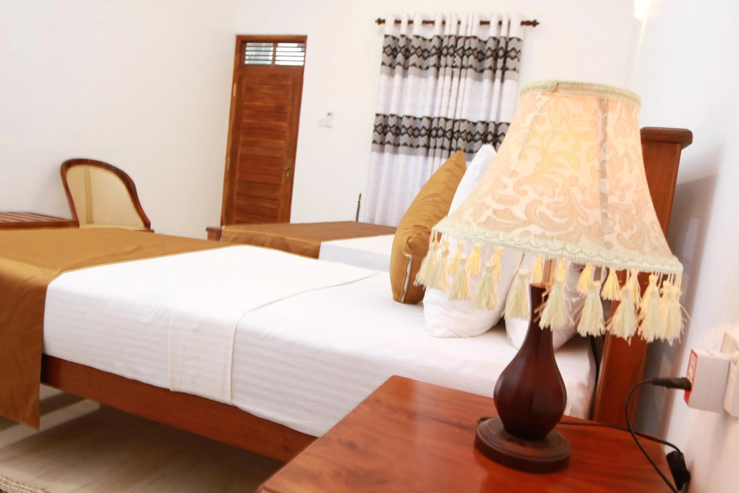 Bed in Hotel Nilketha Yala Tissamaharama