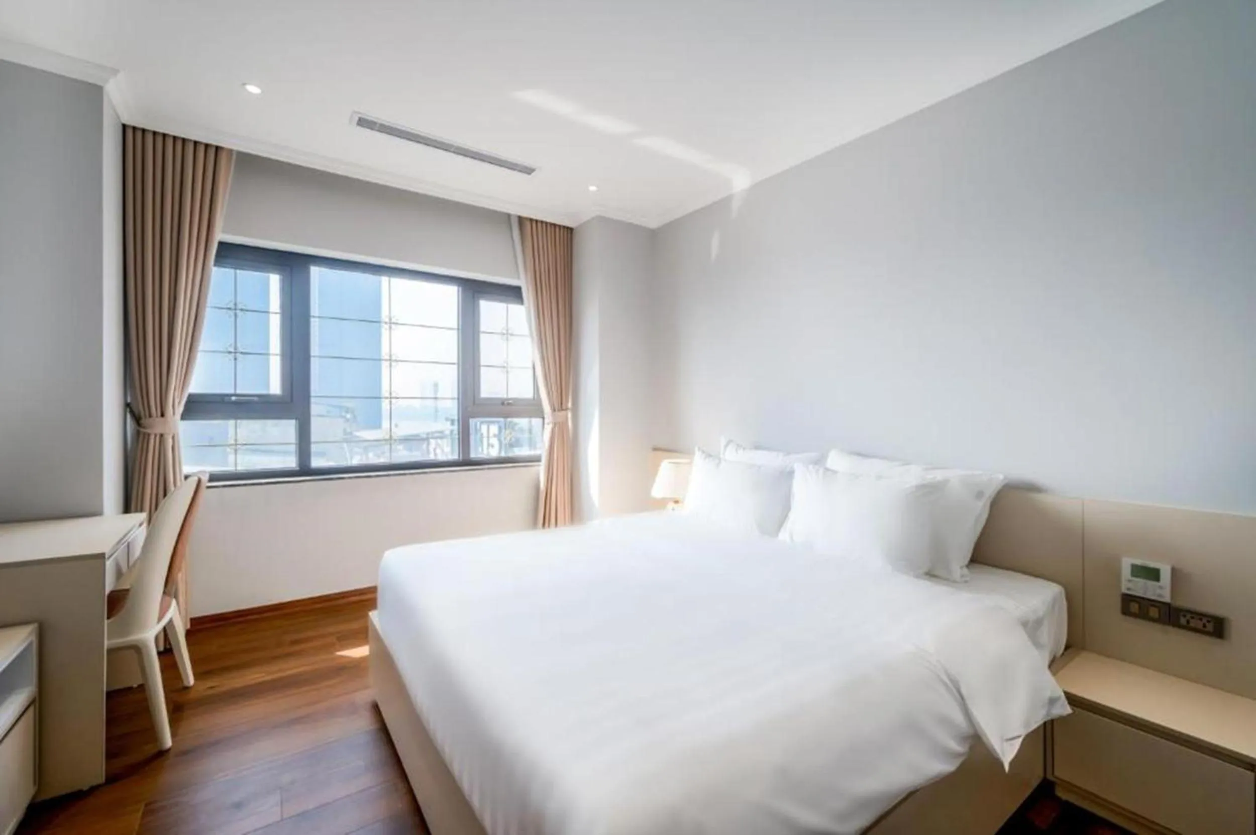 Bed in Luxe Paradise Suites Tay Ho