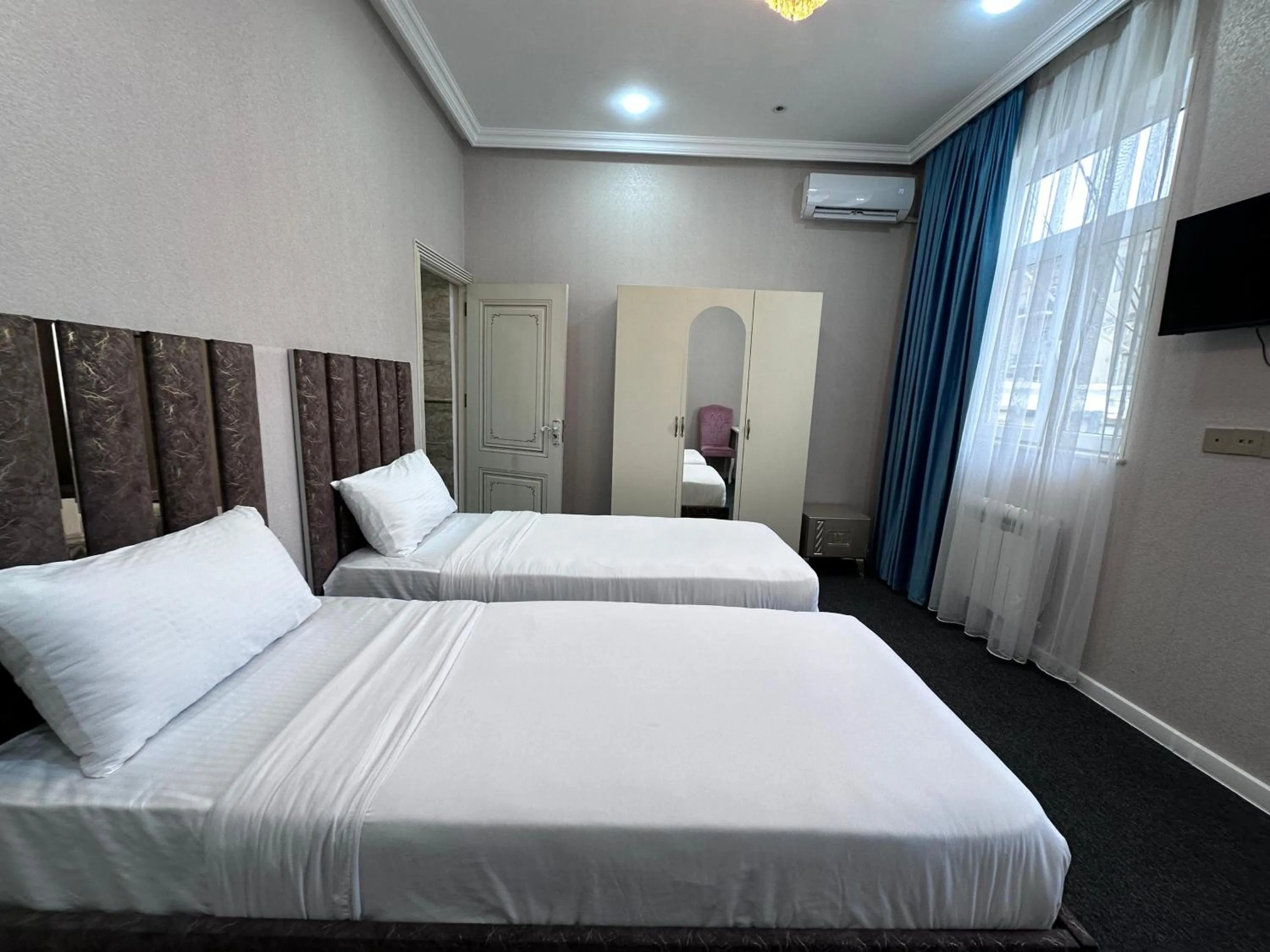 Bed in Central City Hotel