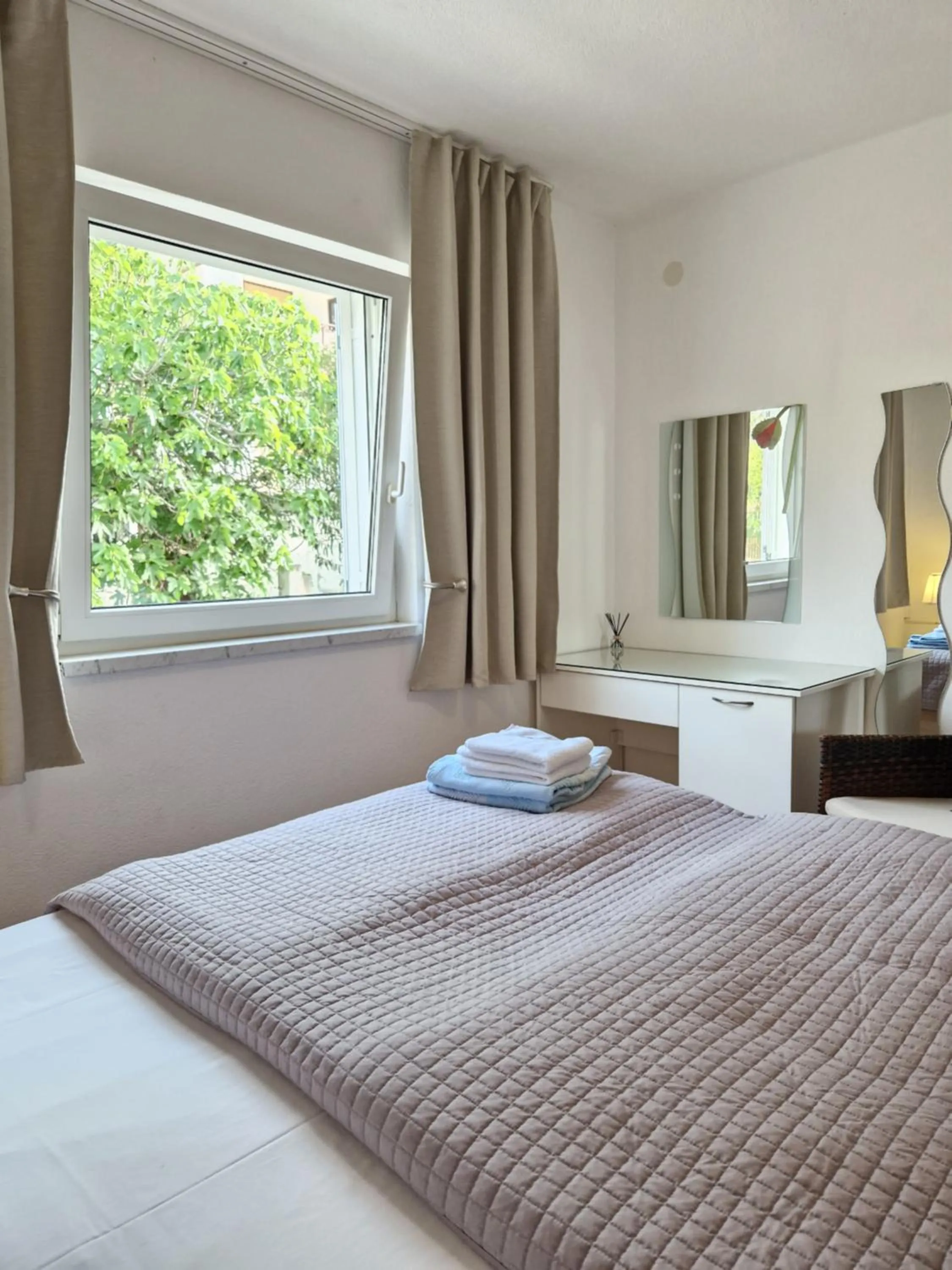 Bed in Apartments Silva with a view of sea